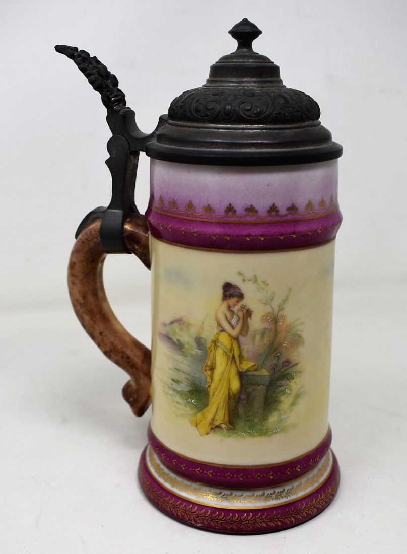1/2 liter Porcelain Beer Stein with Lithopane: A Porcelain Beer Stein with Lithopane of family scenegold decoration around bandingside scenes of a woman posingmint