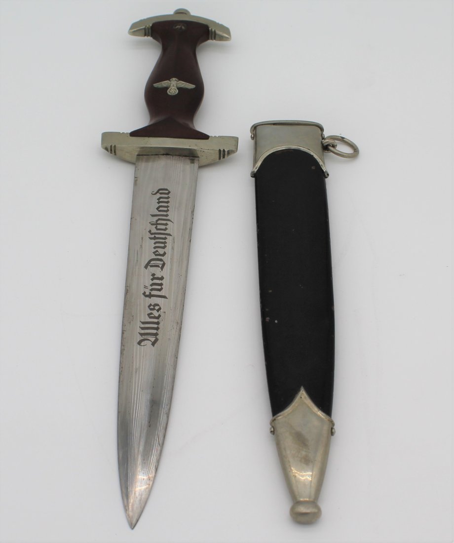 WWII German Nazi Sturmabteilung SA (NSKK) Dagger: WWII German Nazi Sturmabteilung SA (NSKK) Dagger with Scabbard. There is a dent in one side of the Scabbard. The overall length (knife in scabbard) is approx. 14.5" long -- Knife from hilt to tip is a