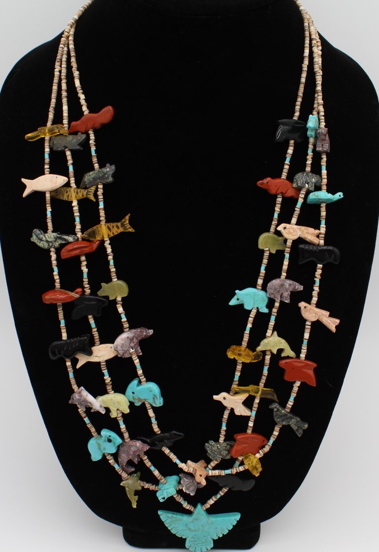 Wonderful Carved Zuni Fetish 3 Strand Necklace Bird and other Animals: Zuni 3 Strand Bird Fetish Necklace. This is a nice older piece and nicely carved. visually the color combinations and staggering makes for a stunning piece to wear.