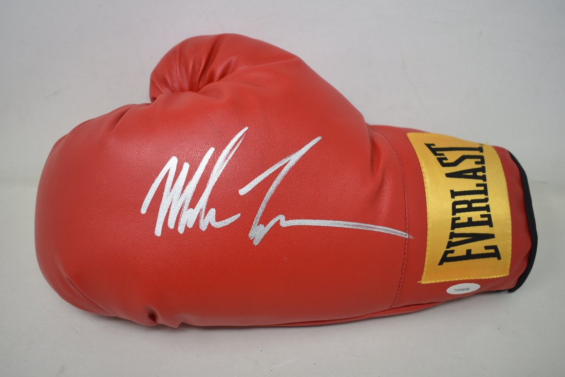 Mike Tyson Autographed Everlast Boxing Golve: Mike Tyson Autographed Everlast Boxing Glove, with authenticity decal.