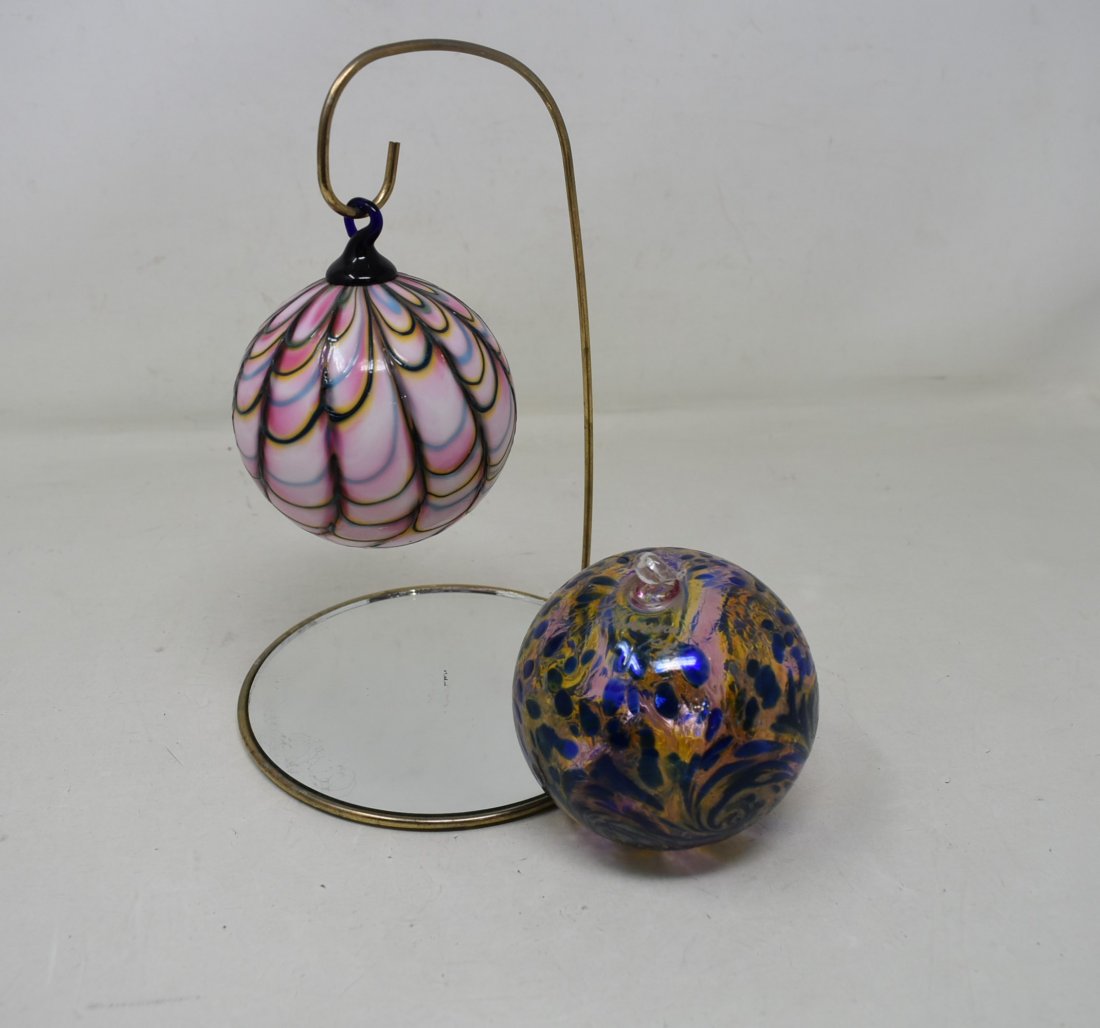 2 Signed Art Glass Ornaments: 2 Signed Art Glass Ornaments with one stand. The blue ornament is signed JR Grossman. The pink is unreadable.