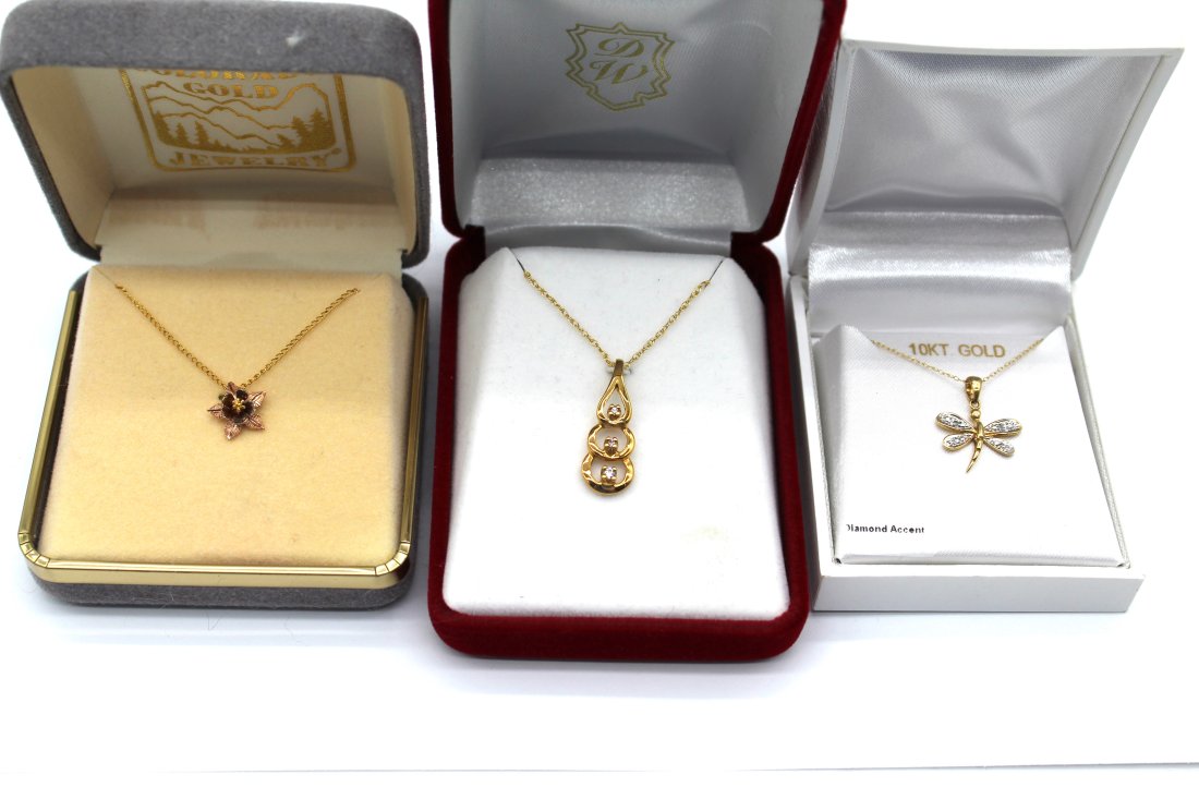 14K 10K Gold Necklace and Pendant Lot: 14K 10K Gold Necklace and Pendant Lot - The Floral Piec Pendant Marked 10K, Chain Marked 1/20 Gold Filled - Tear Drop Pendant Marked 14K and Chain as Well - Butterfly/Dragonfly Marked 10K on Bothe Nec