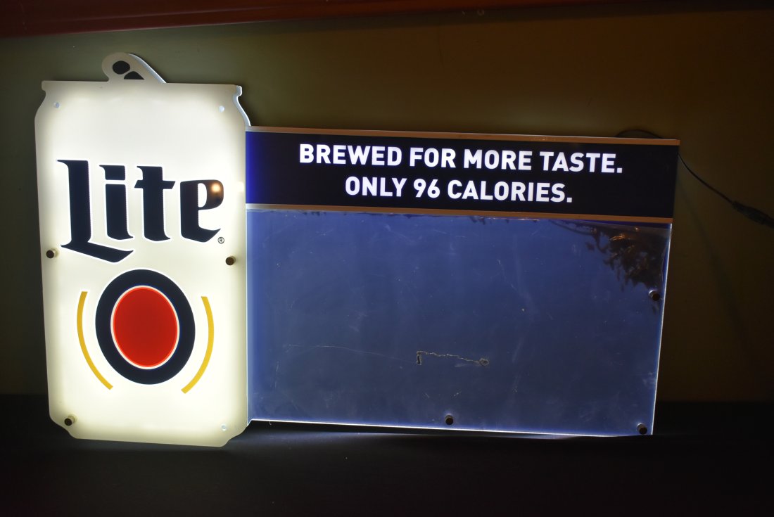 Miller Lite LED Sign/Light with Write-on Board: Miller Lite LED Sign Light with Write-On Board. In new condition with plastic film still on front. Works great, but is missing 3 screws on the beer can. Easy fix. 26"
