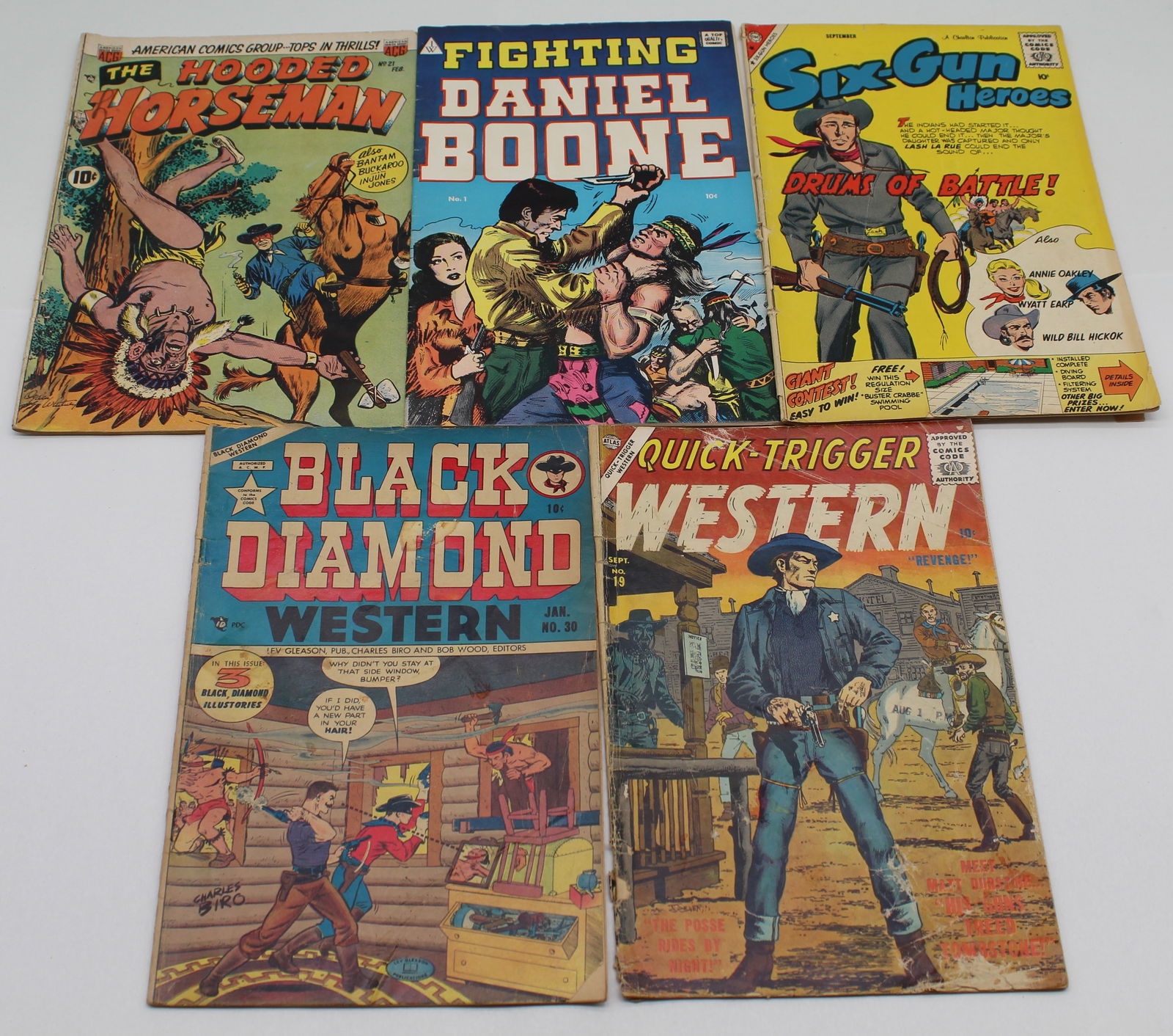 5 Golden Age Western Comics - Six-Gun Heroes Hooded Horseman #21 Fighting Daniel Boone #1 +2 more: 5 Golden Age Western Comics - Six-Gun Heroes Hooded Horseman #21 Fighting Daniel Boone #1 Quick-trigger Western #19 Black Diamond Western #30 - six-gun heroes has Coupon cut from back cover - books ma