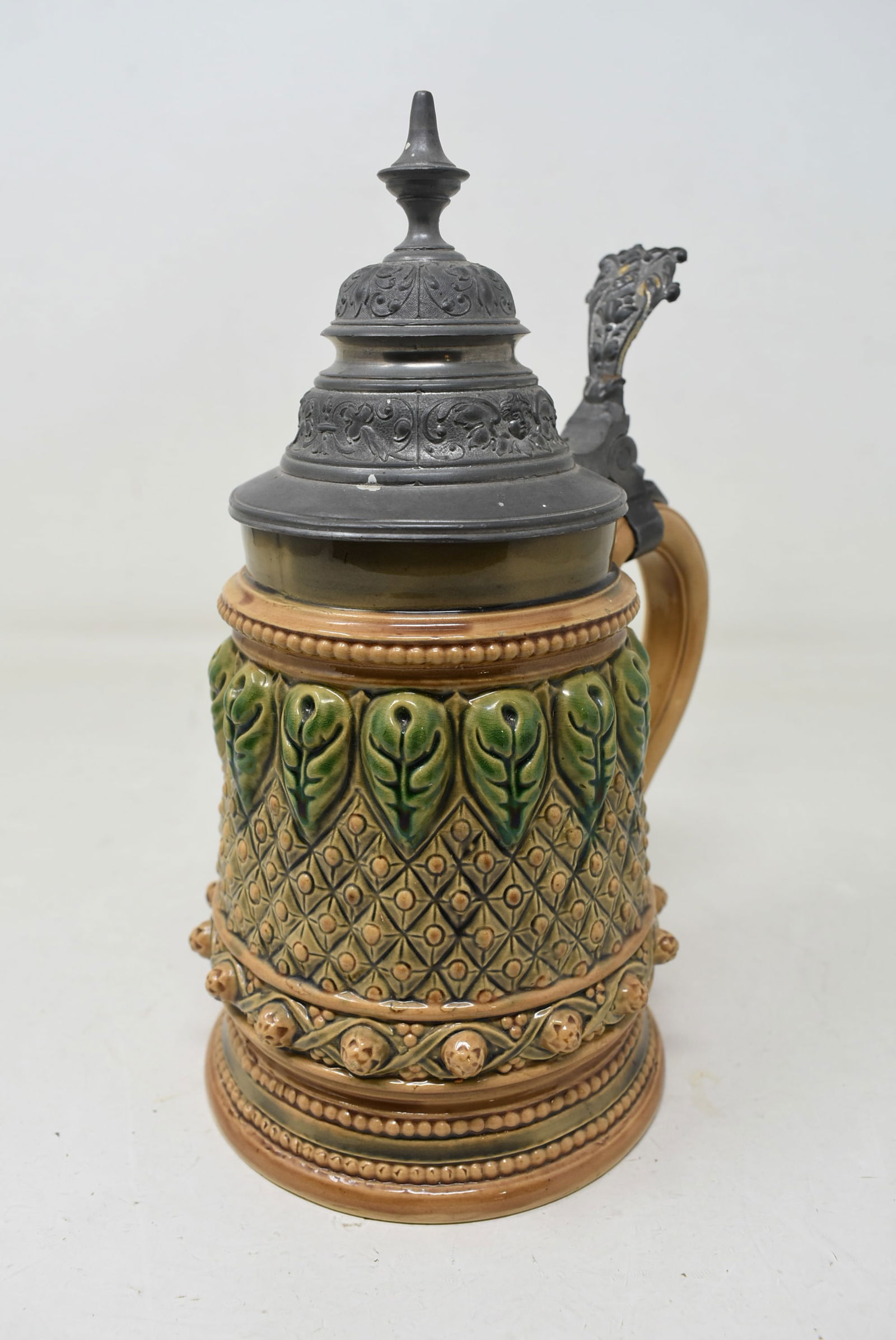 Unusual 1/2 Liter Art Deco Beer Stein with Prunts Pewter Lid: 1/2 Liter Art Deco Beer Stein with Pewter Lid. In nice condition with no damage. Unusual repeating decoration marked Patent 54 on bottom rim