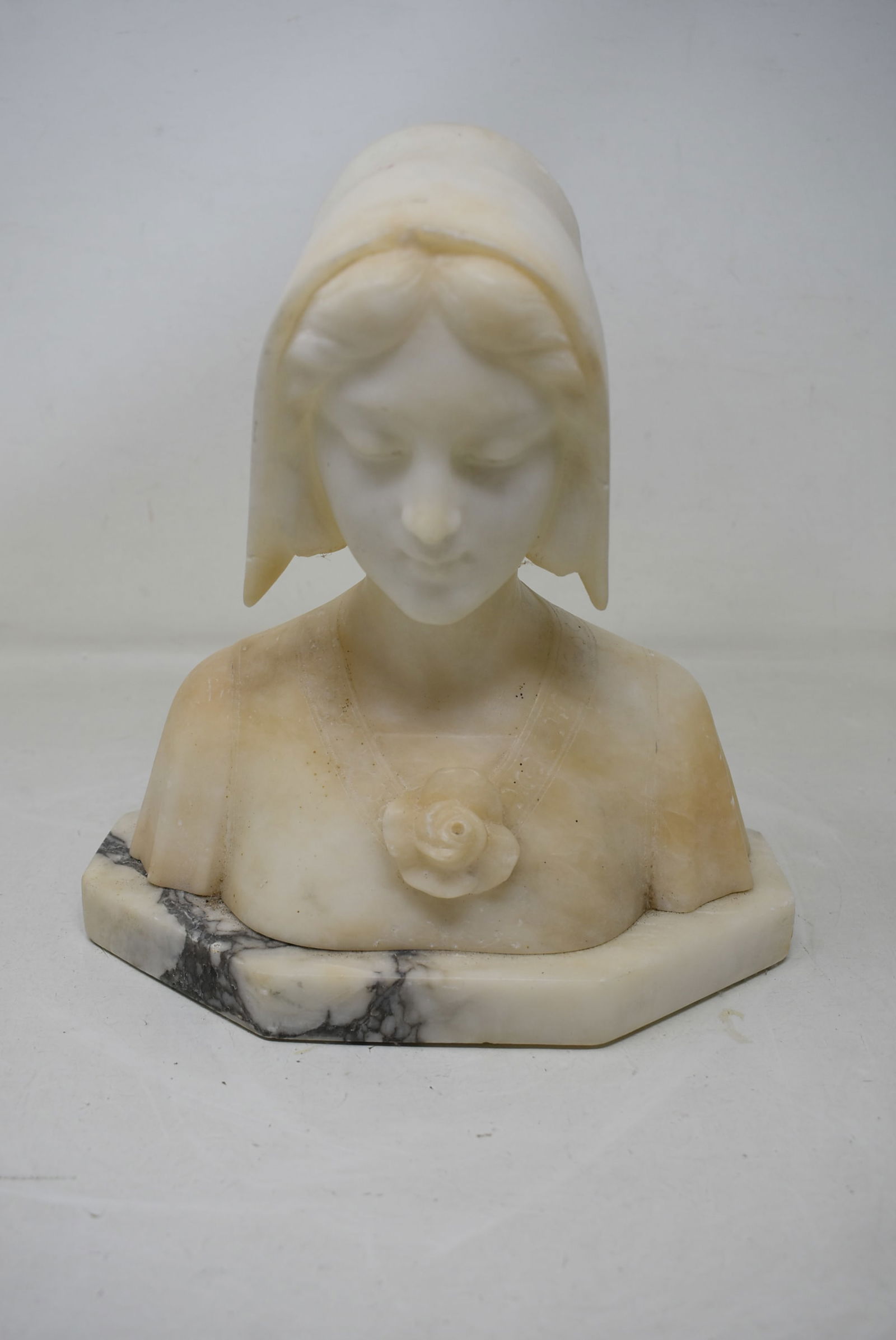 Alabaster Bust 9" Woman: Vintage Alabaster Bust, Woman in a hat measuring 9" tall. In good condition with small chips on hat.