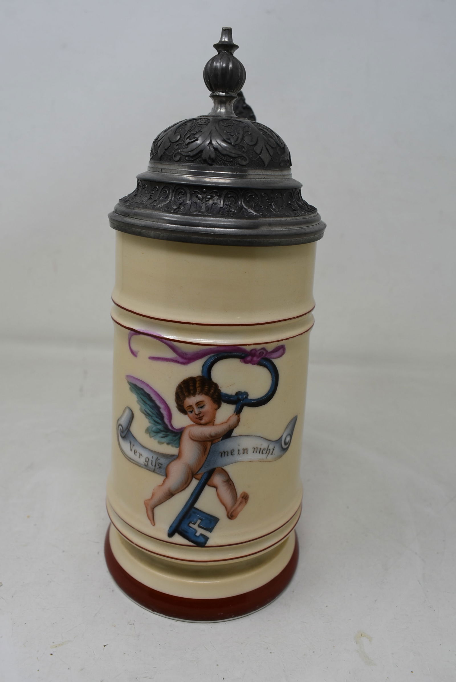 1/2 Liter Porcelain Beer Stein with Angel: 1/2 Liter Porcelain Beer Stein with Angel, elaborate pewter lid and lithophane bottom. "Forget me not". In excellent condition.