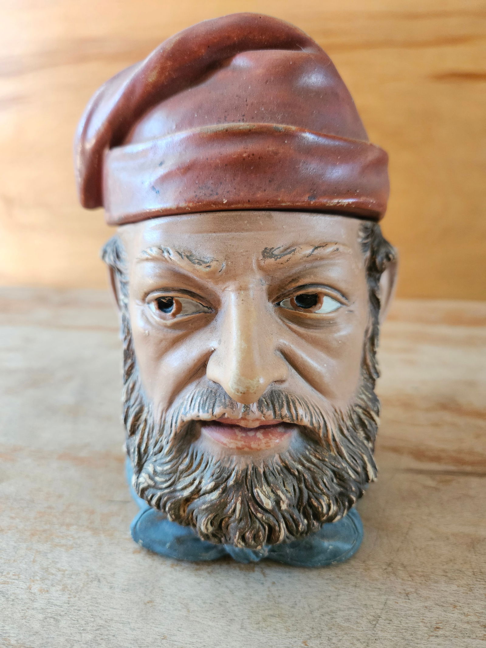 Vintage Bearded Man Lidded Tobacco Jar: Vintage Bearded Man Hand Painted Lidded Tobacco Jar. It measures 6" tall. Some light paint wear, small chip on back and chips on underside of lid.