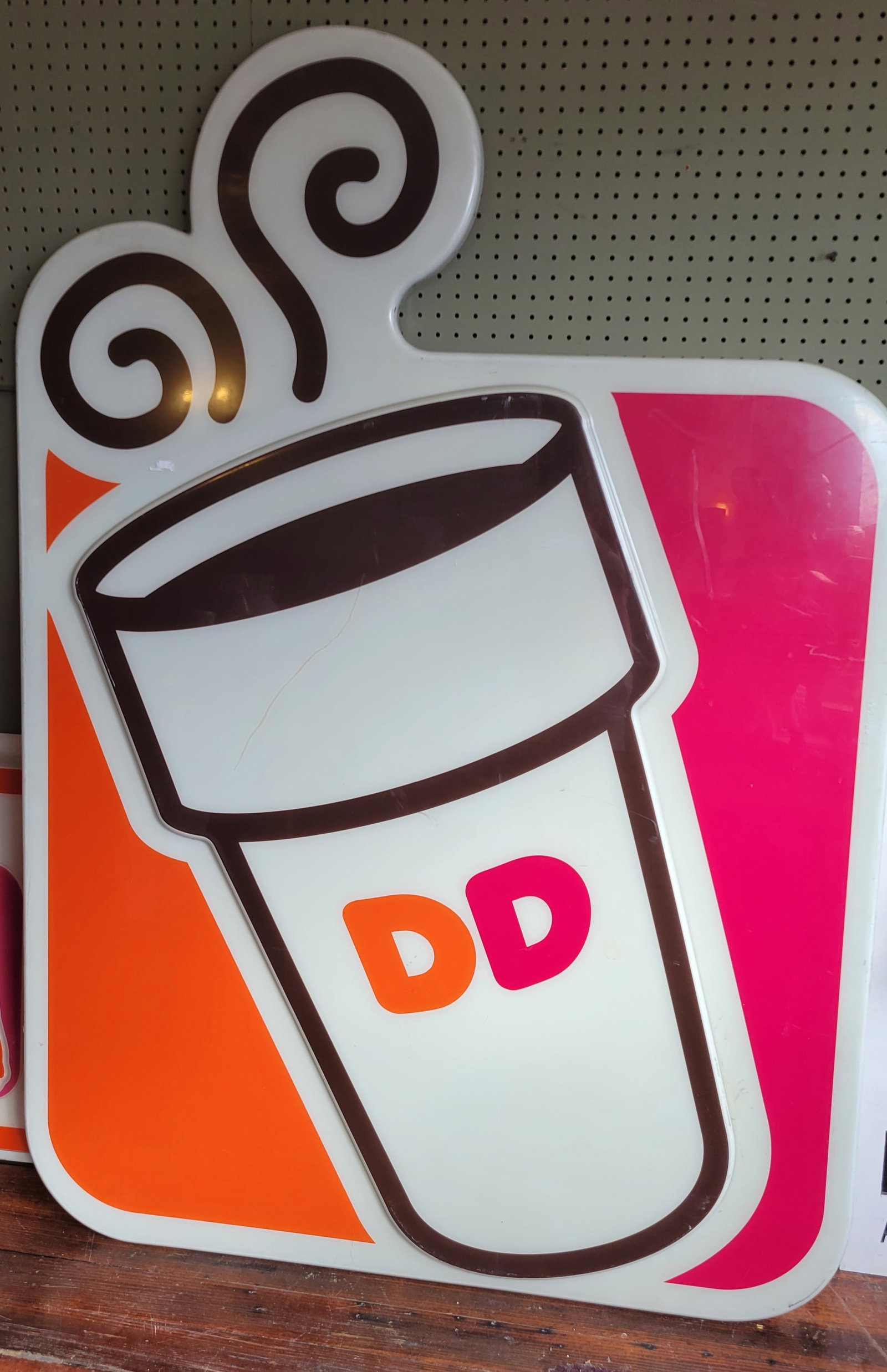 Large Dunkin Donuts Sign 68": Large Dunkin Donuts Sign, measures 68" x 48". Some surface wear but overall in nice condition. Has a wire on the back to hang!