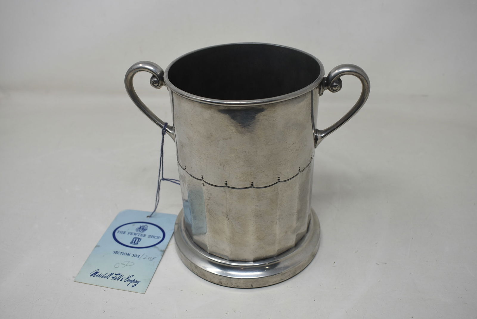 Antique Pewter Wine Stand c1850-1870 England: Antique Pewter Wine Staind c. 1850-1870 England. It has a wood base and is marked 16441. It came from the Marshall Fields Pewter Shop.