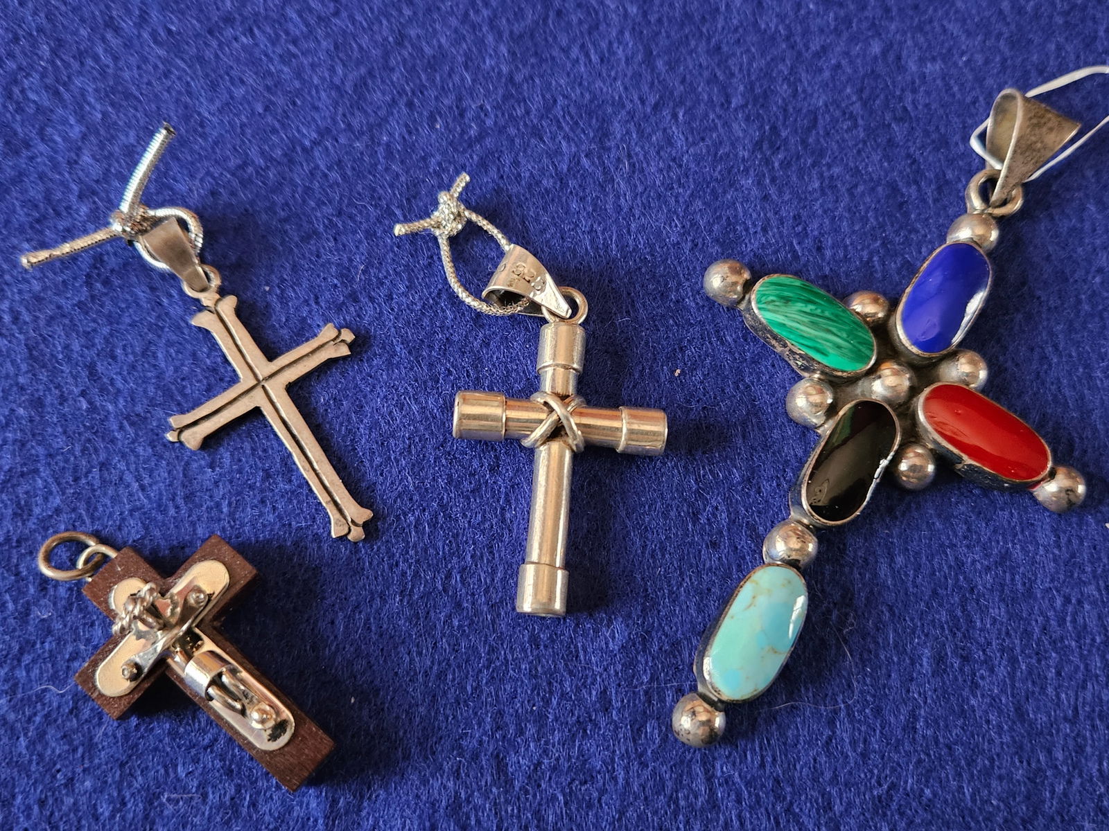 Lot of 4 Sterling Silver Cross Pendants: A group of 4 sterling silver cross pendants. All are in excellent condition.