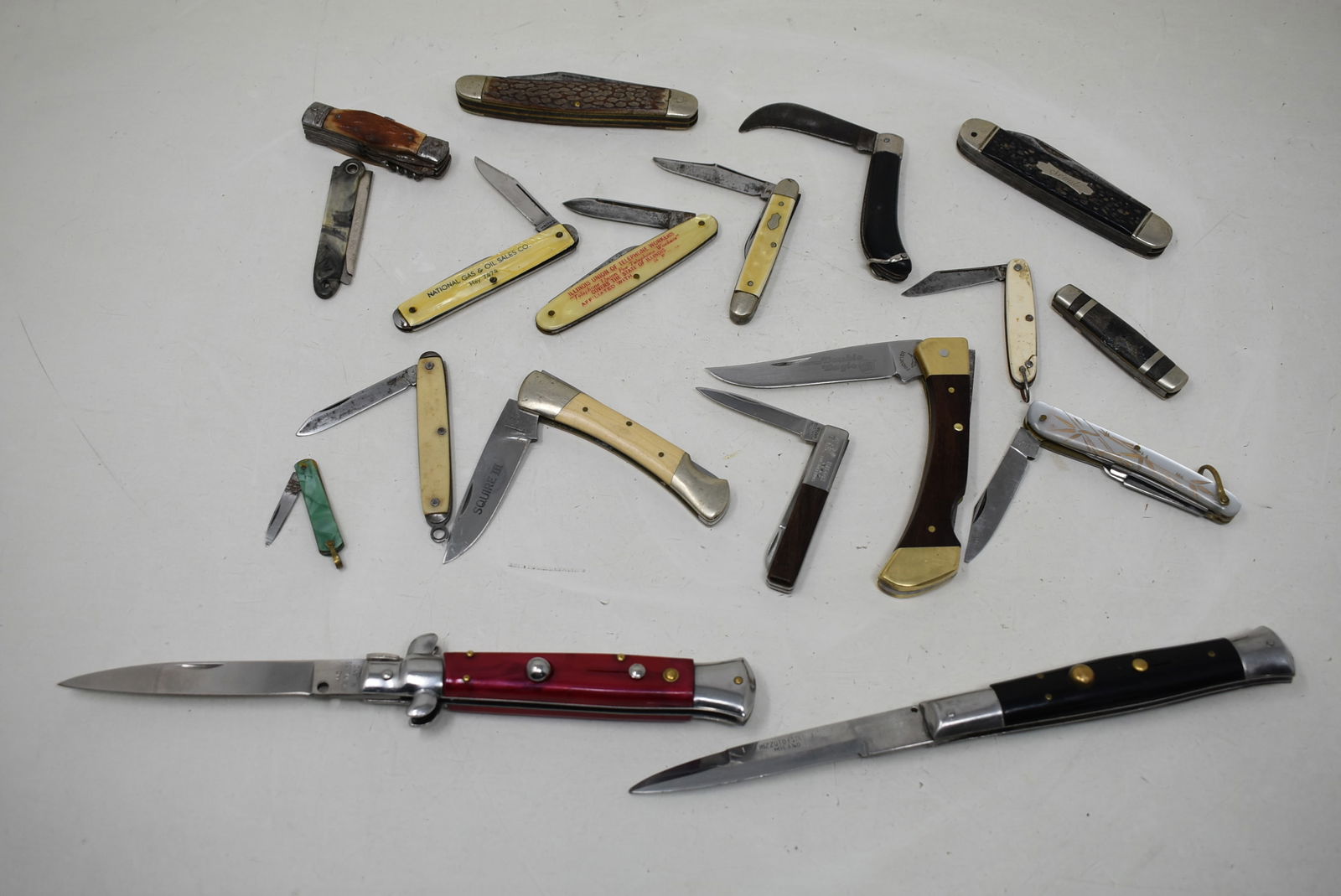 Group of 18 Assorted Knives: A Group of 18 Knives including 16 Pocket Knives and 2 Switchblade Knives. As shown