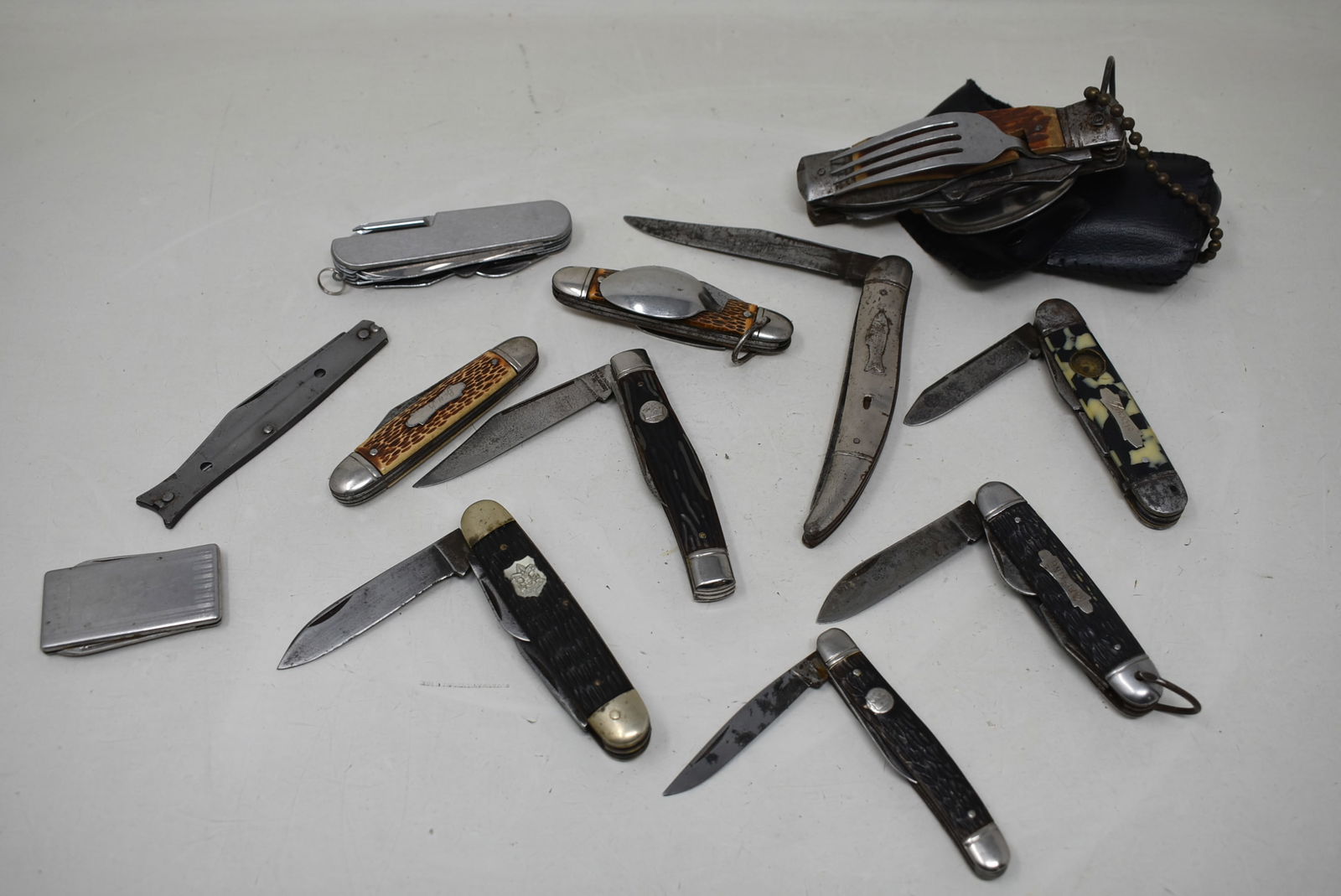 Group of 12 Pocket Knives: A Group of 12 Pocket Knives, as shown. Some have wear.