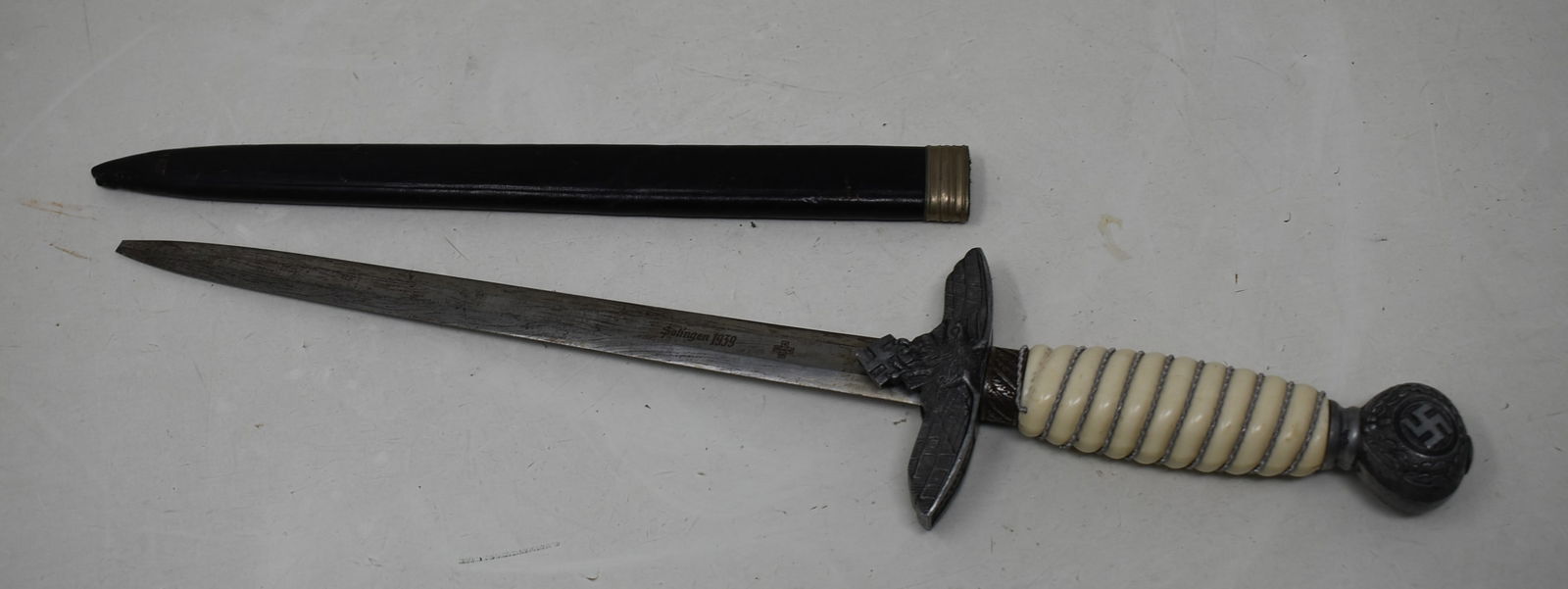 German WWII Luftwaffe Dagger with Leather Scabbard: WWII German Luftwaffe Dagger with Leather Scabbard. The tip of the dagger is missing, otherwise clean condition.