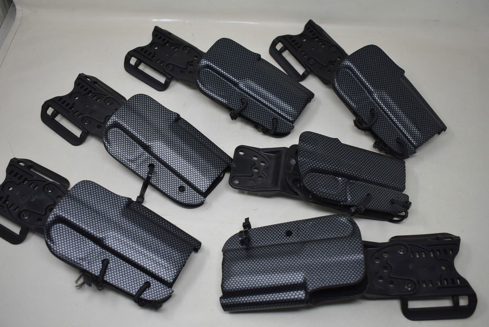 Lot of 6 Thermoplastic Gun Holsters Bladetech: A Group of 6 Thermoplastic Gun Holsers by Bladetech. In good used condition.