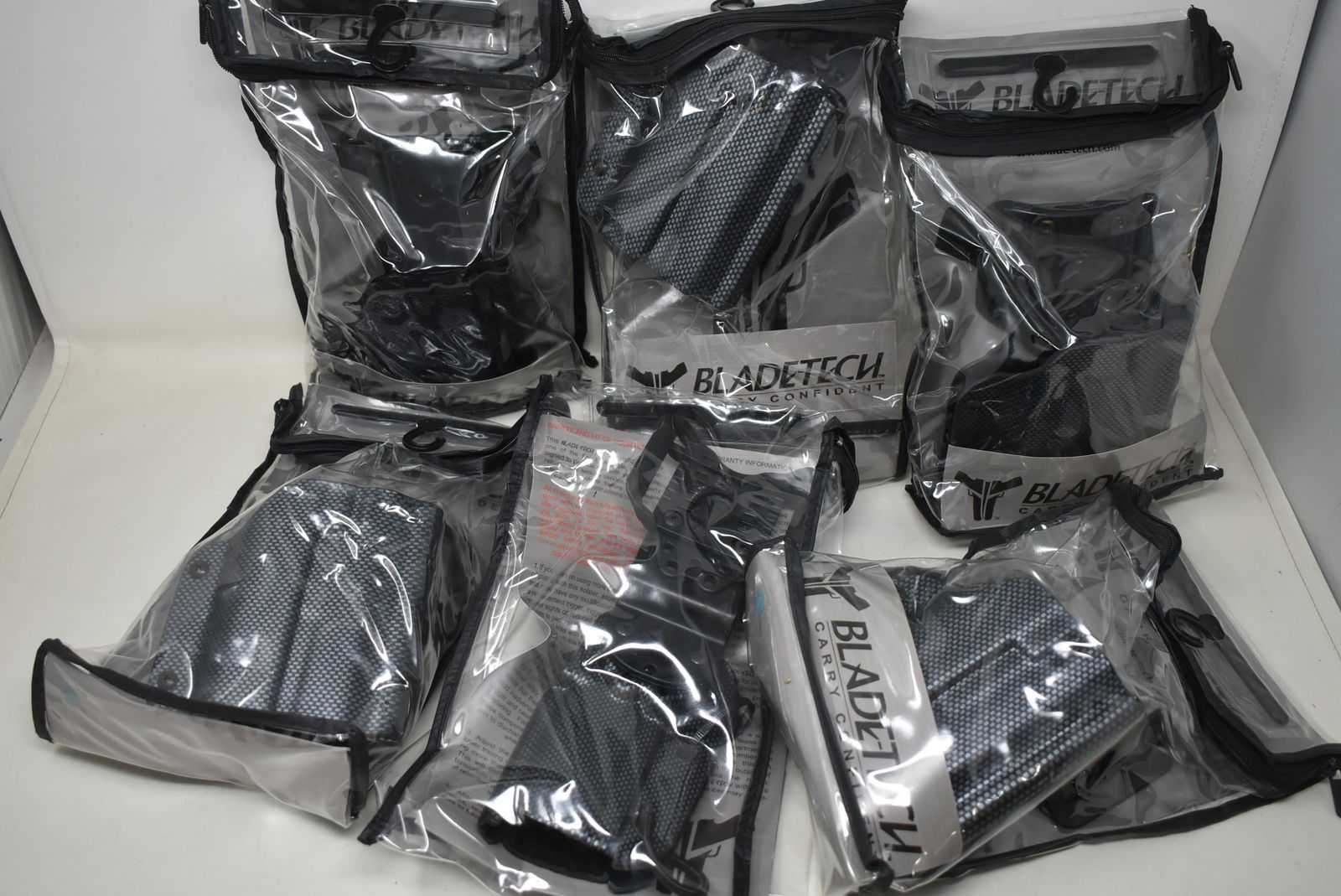 Lot of 6 Thermoplastic Gun Holsters Bladetech NEW: A Group of 6 Thermoplastic Gun Holsers by Bladetech. They are new in packages.