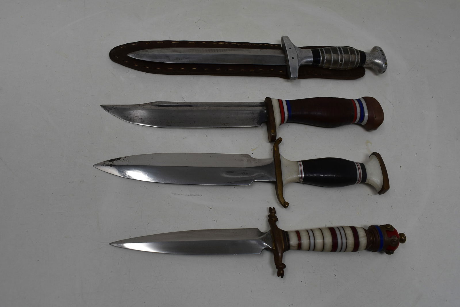 4 Fixed Blade Knives: A Lot of 4 Fixed 6" Blade Knives. AS shown