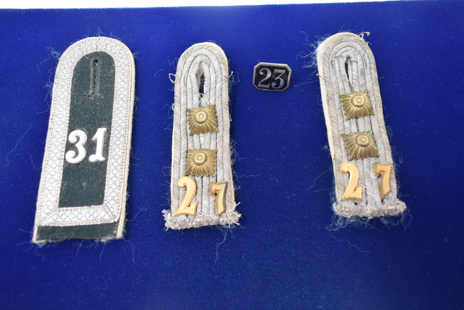 Group of German Hat Badges & Pin: A Group of German Hat Badges and a Pin