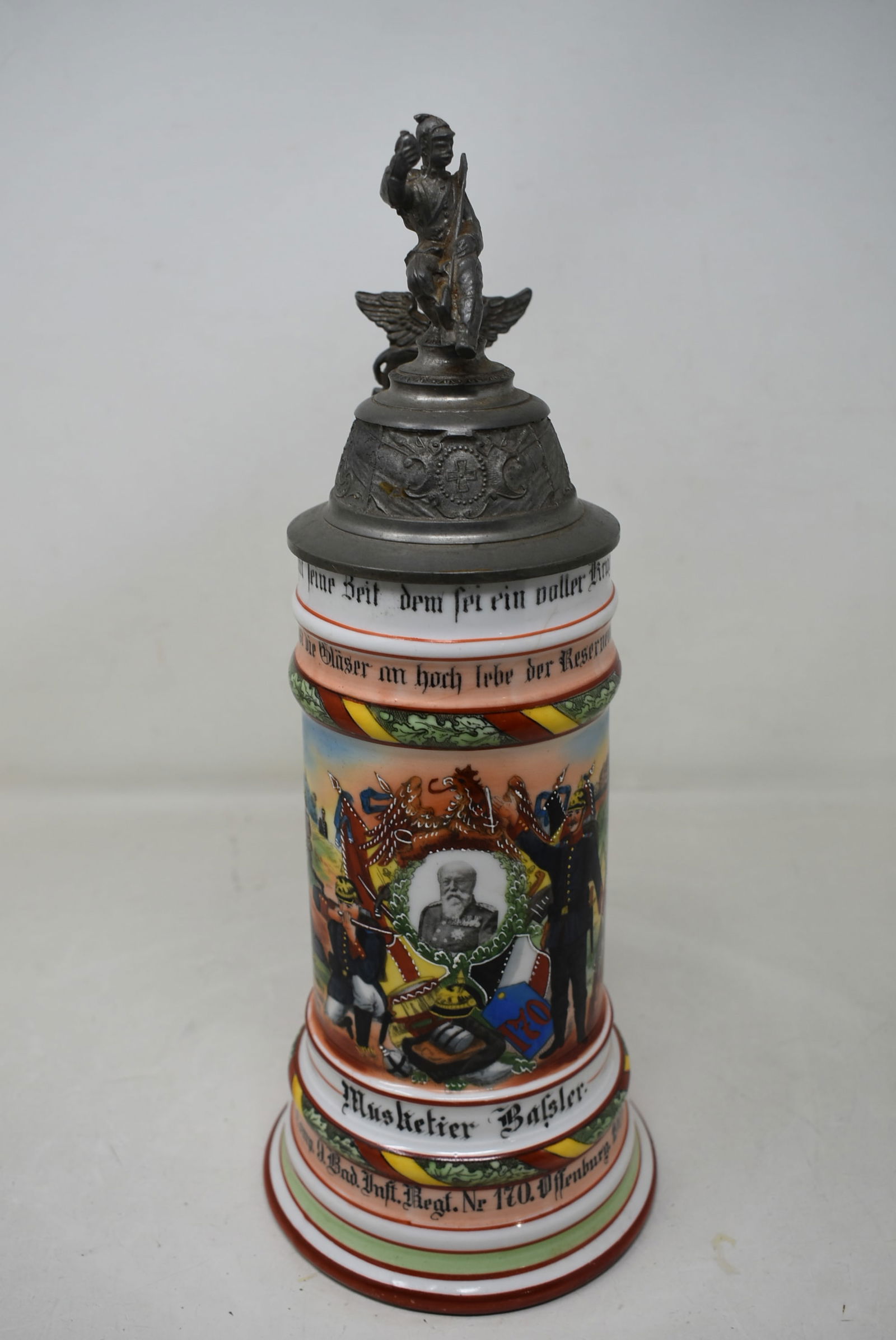 1/2 Liter German Regimental Porcelain Beer Stein 1905-07: German Regimental Beer Stein 1905/07, Muskettier Bafsler, Reg. 170 Offenburg. In nice condition, strap has some play.
