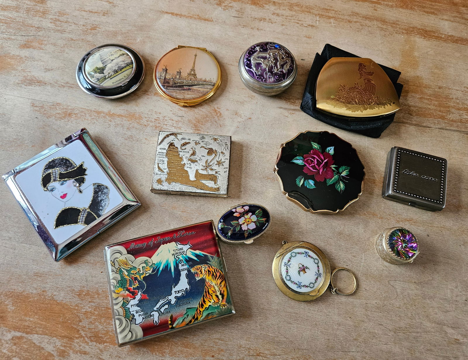 Lot of 12 Compacts: A group of 12 Compacts.