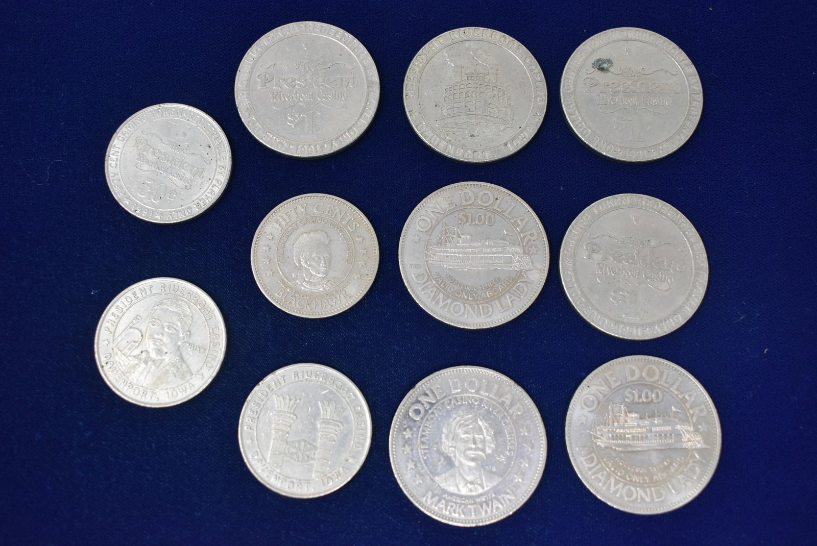 Lot of Vintage Riverboat Casino Tokens/Chips: A Group 11 Vintage Riverboat Casino Tokens, Chips.