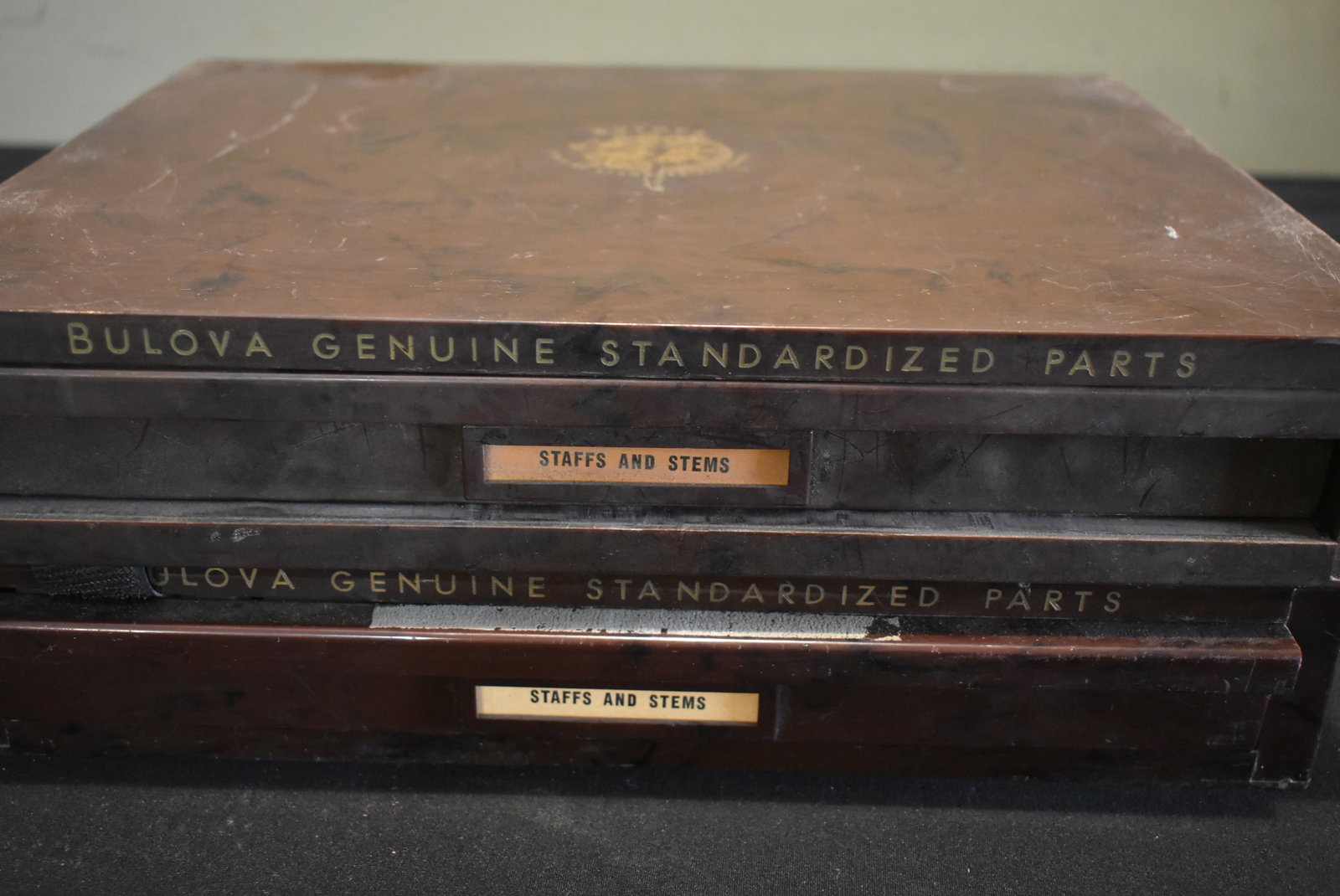 2 Old Bulova Watchmaker Drawers with NOS Parts: Lot of 2 Old Bulova Watchmaker Drawers. One includes New Old Stock parts. Both drawers have dividers, as shown. They measure 13" x 10" x 2"