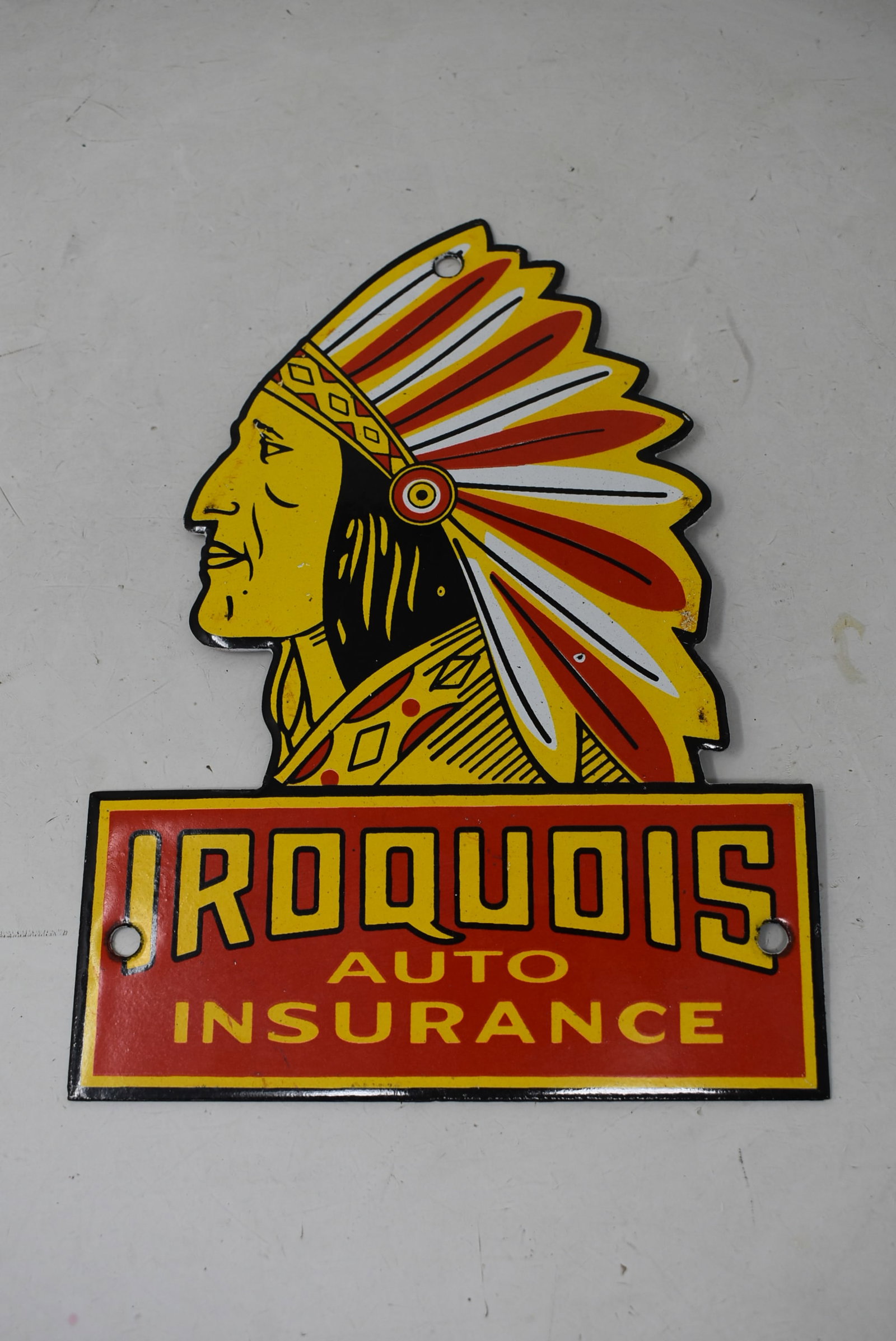 Iroquois Auto Insurance Porcelain Sign with Indian: Iroquois Auto Insurance Porcelain Sign with Indian. It measures 8"x6" and comes in nice condition with very light wear.