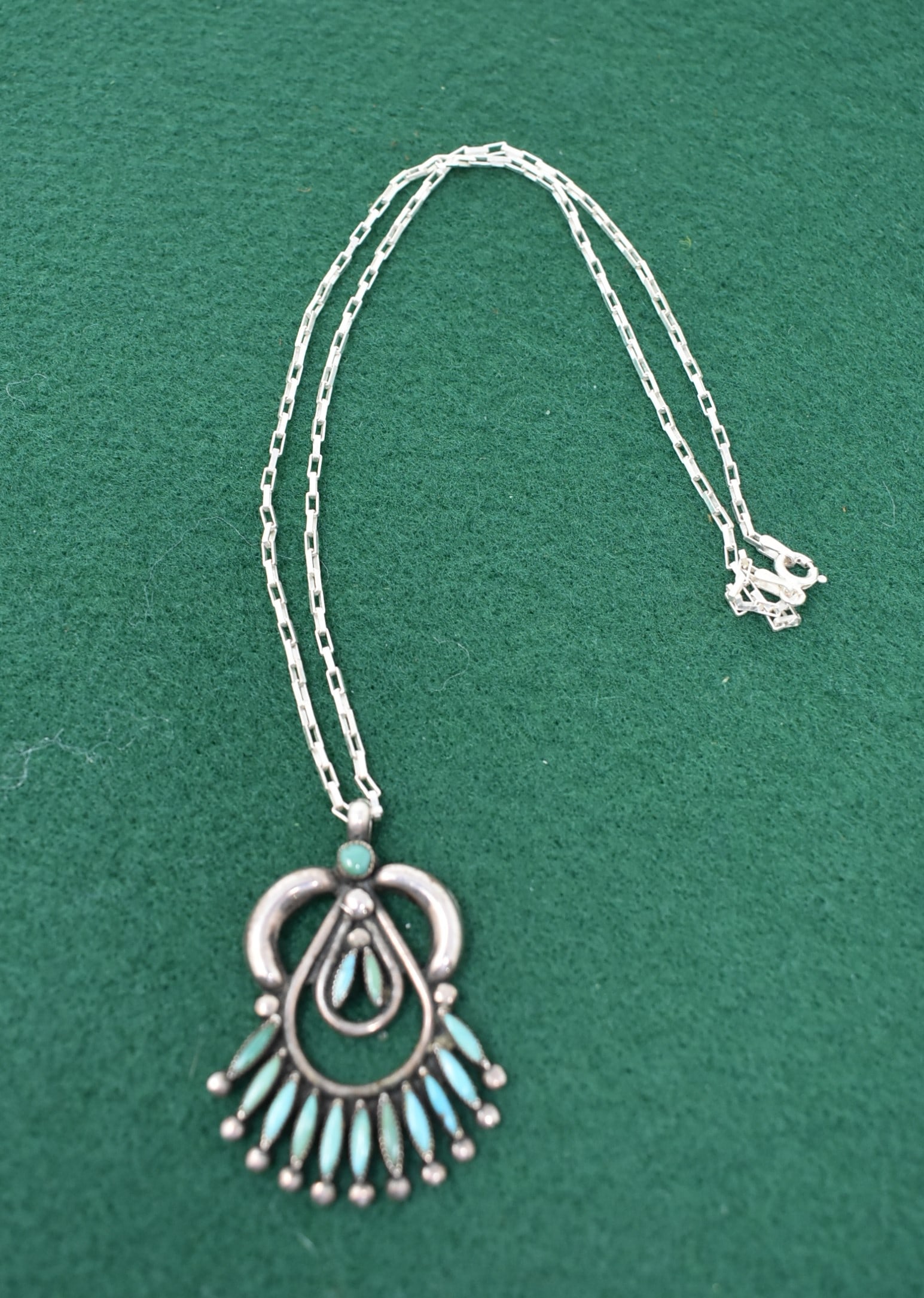 Zuni R Gchachu Sterling Silver Turquoise Necklace: R. Gchachu Sterling Silver & Turquoise Necklace. The pendant measures 2" with a 18" Sterling Chain. In nice condition, signed.