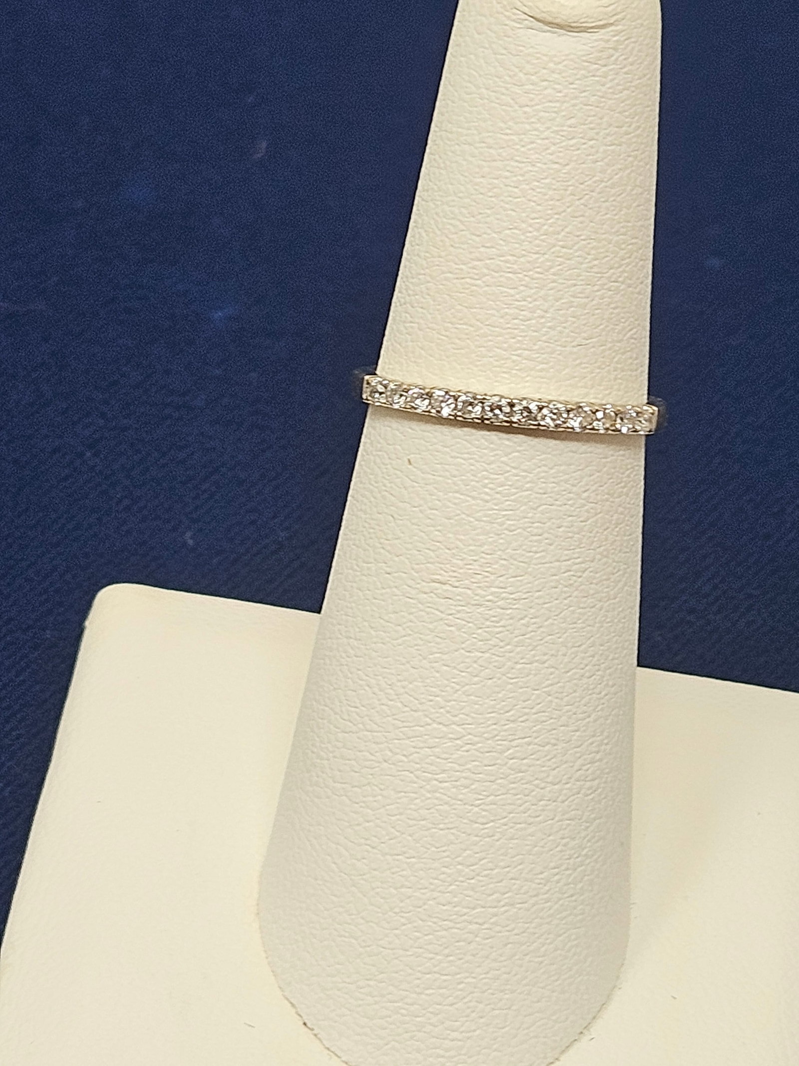 14K White Gold Diamond Half-Eternity Band: 14K White Gold Diamond Half-Eternity Band, size 5.5. It weighs 1.6 grams.