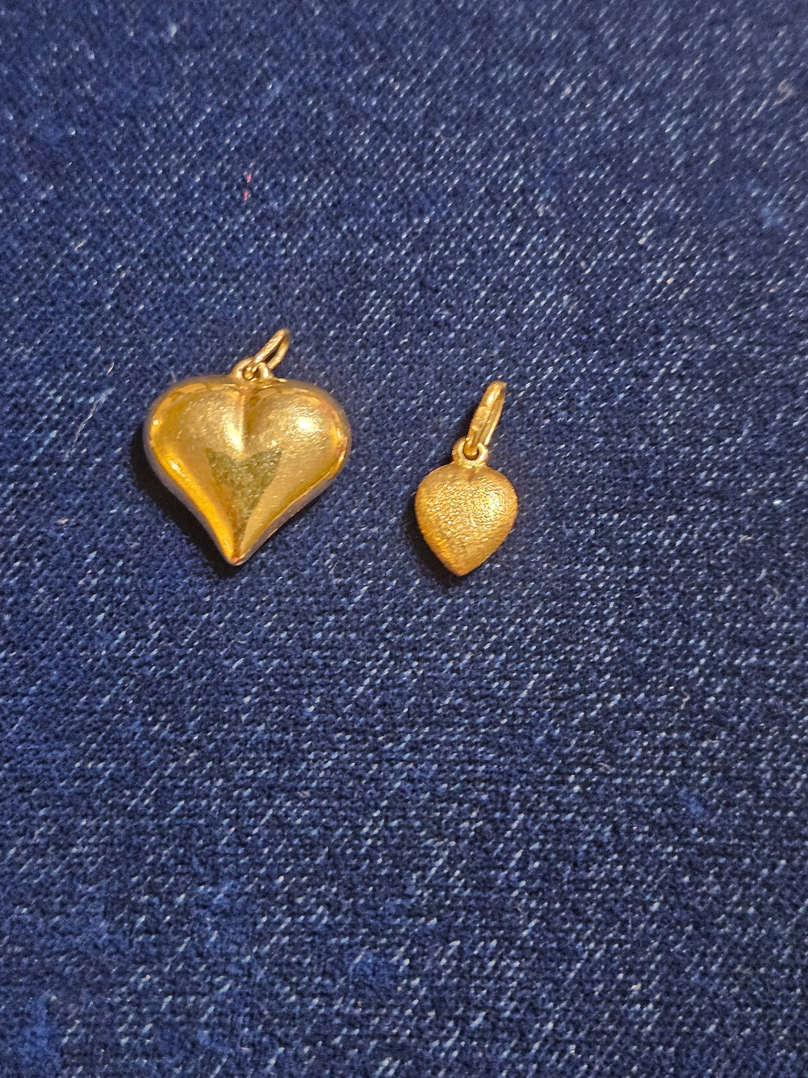 18K & 14K Gold Heart Pendants: 18K & 14K Gold Heart Pendants. The 18K weighs .7 grams and the 14K weighs .8 grams.
