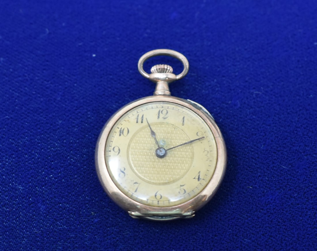 Women's Gold Filled Pocket Watch: Vintage Women's Gold-Filled Pocket Watch. It measures 1" in diameter and is not running.
