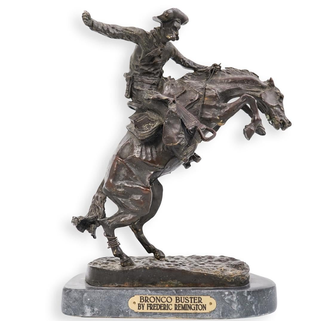 Frederic Remington - Bronco Buster: (After) Frederic Remington (1861 – 1909, American) “Bronco Buster” – Bronze reproduction of the 1895 statue by the renowned artist of the American West. A cowboy with one foot in a stirrup and