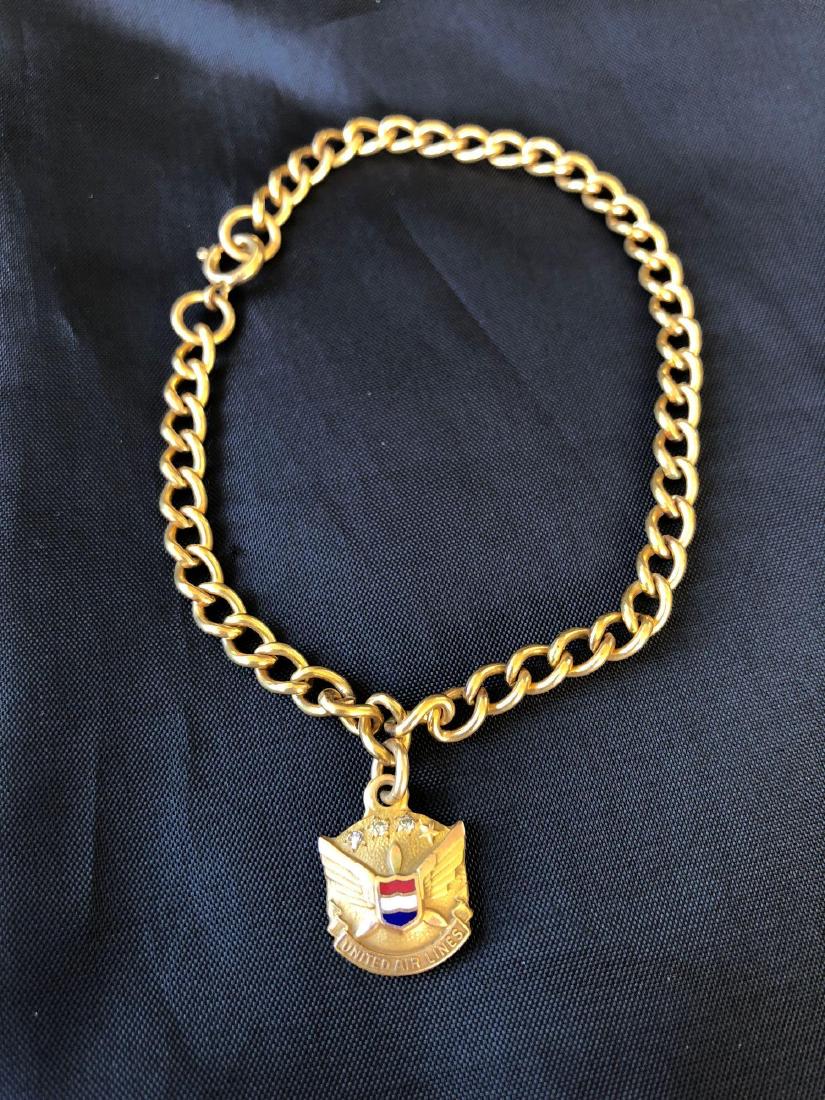 United Airlines 10K Gold and Diamond Employee Service B: United Airlines employee service bracelet made of 10K and three diamonds. 7.7g Total Weight with chain. Chain is marked 1/20 12k.