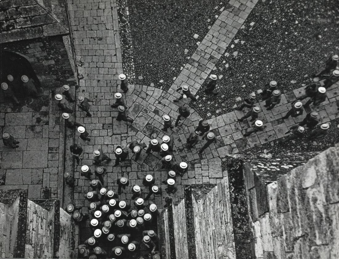 CORNELL CAPA (1918–2008) Boys entering the chapel at: Vintage silver print 25,7 x 33,8 cm Photographer's copyright stamp, agency stamp and and various notations in pencil on the reverse LITERATURE Richard Whelan (ed.), Cornell Capa. Photographs; 1992, p.
