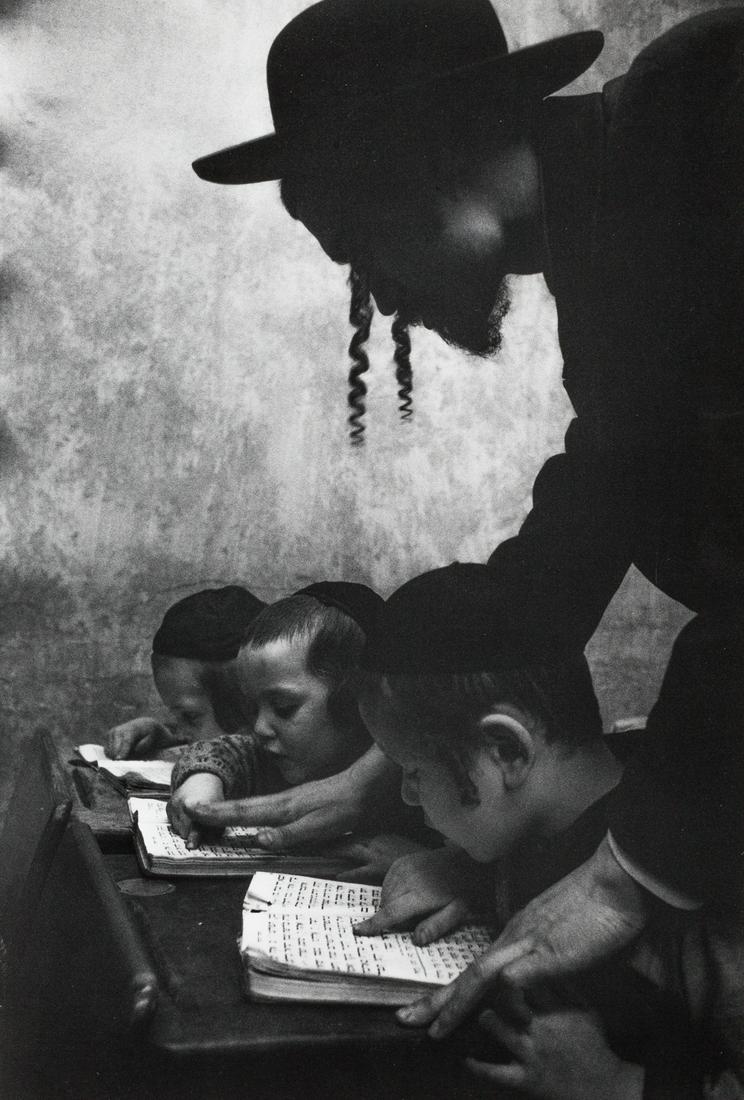 CORNELL CAPA (1918–2008) Hebrew lesson, Brooklyn, New: Vintage silver print 34,2 x 22 cm Photographer's credit stamp on the reverse, annotated in an unidentified hand in ink in the margin LITERATURE Richard Whelan (ed.), Cornell Capa. Photographs; 1992, p