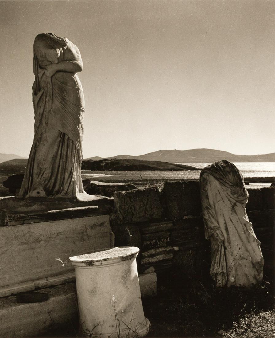 HERBERT LIST (1903–1975): HERBERT LIST (1903–1975) | Statues of Kleopatra and Dioskorides on the island of Delos, Greece 1938 Image Size: 30,2 x 24,9 cm English: Gelatin silver print, printed in the 1980s, double-weight
