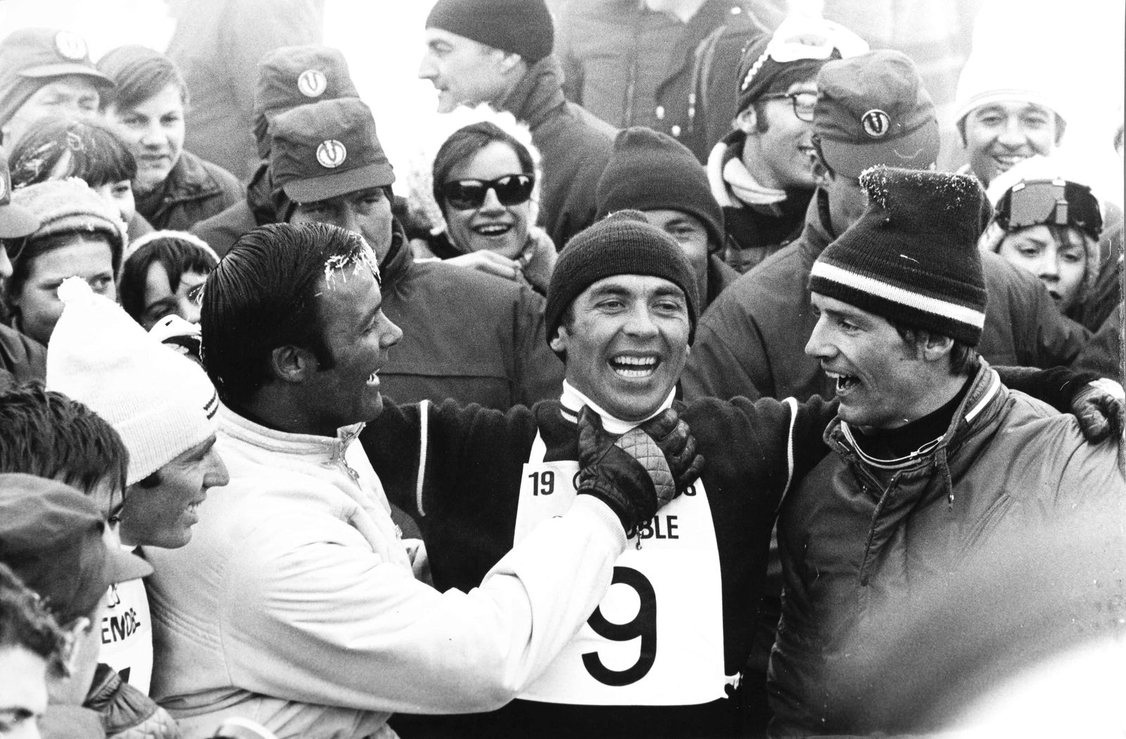 DANIEL CAMUS (1929–1995) | Olympia Grenoble, Karl Schranz as the presumed winner, 1968: Karl Schranz as the presumed winner, surrounded by Toni Sailer, Herbert Huber and Jean Claude KillyVintage print, 20 x 30 cm, stamped