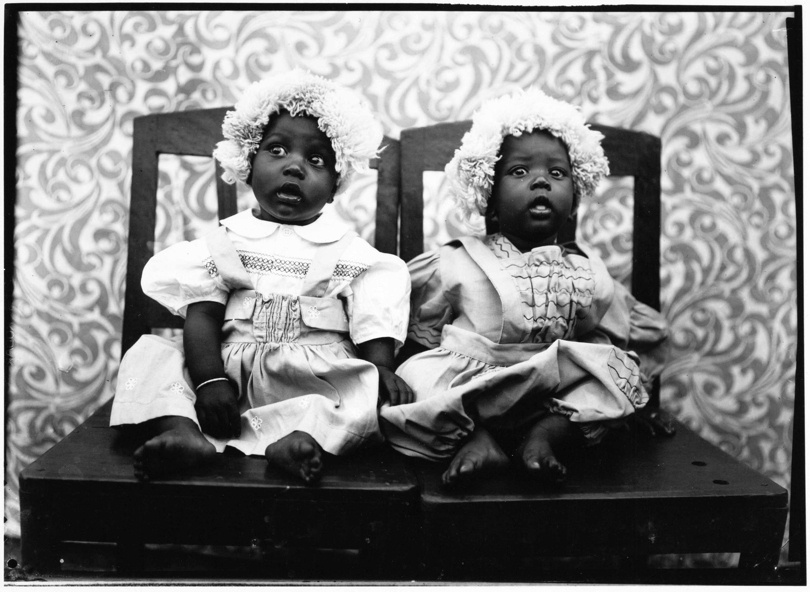 SEYDOU KEïTA (1921–2001): SEYDOU KEïTA (1921–2001) | Twins in European Dress, 1950s Image size: 17 x 23.5 cm English Gelatin silver print, printed in the 1990s on double-weight semi-glossy paper c. 24 x 30 cm, in ve