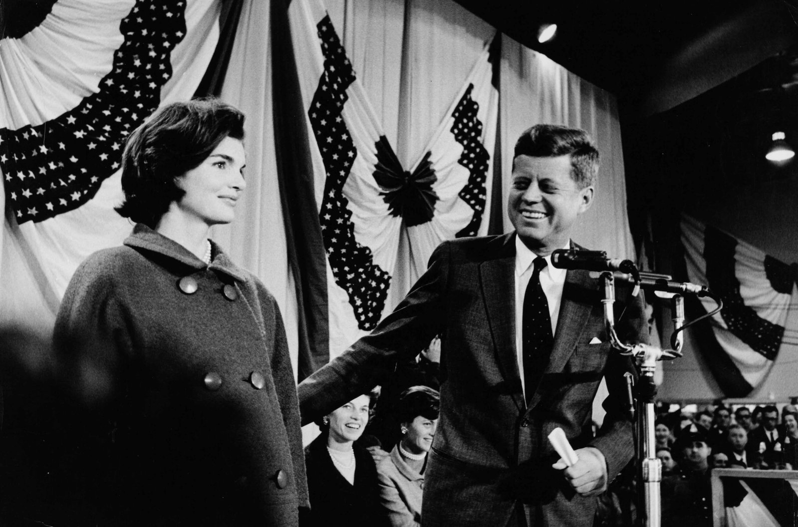DALMAS | John F. Kennedy with Jacqueline Kennedy at presidential election campaign, 1960: Vintage print, stamped, 30 x 20 cm Kennedy?s relaxed smile and Jacqueline?s composed presence reflect the carefully cultivated public image of the young couple during a campaign that placed unusual em
