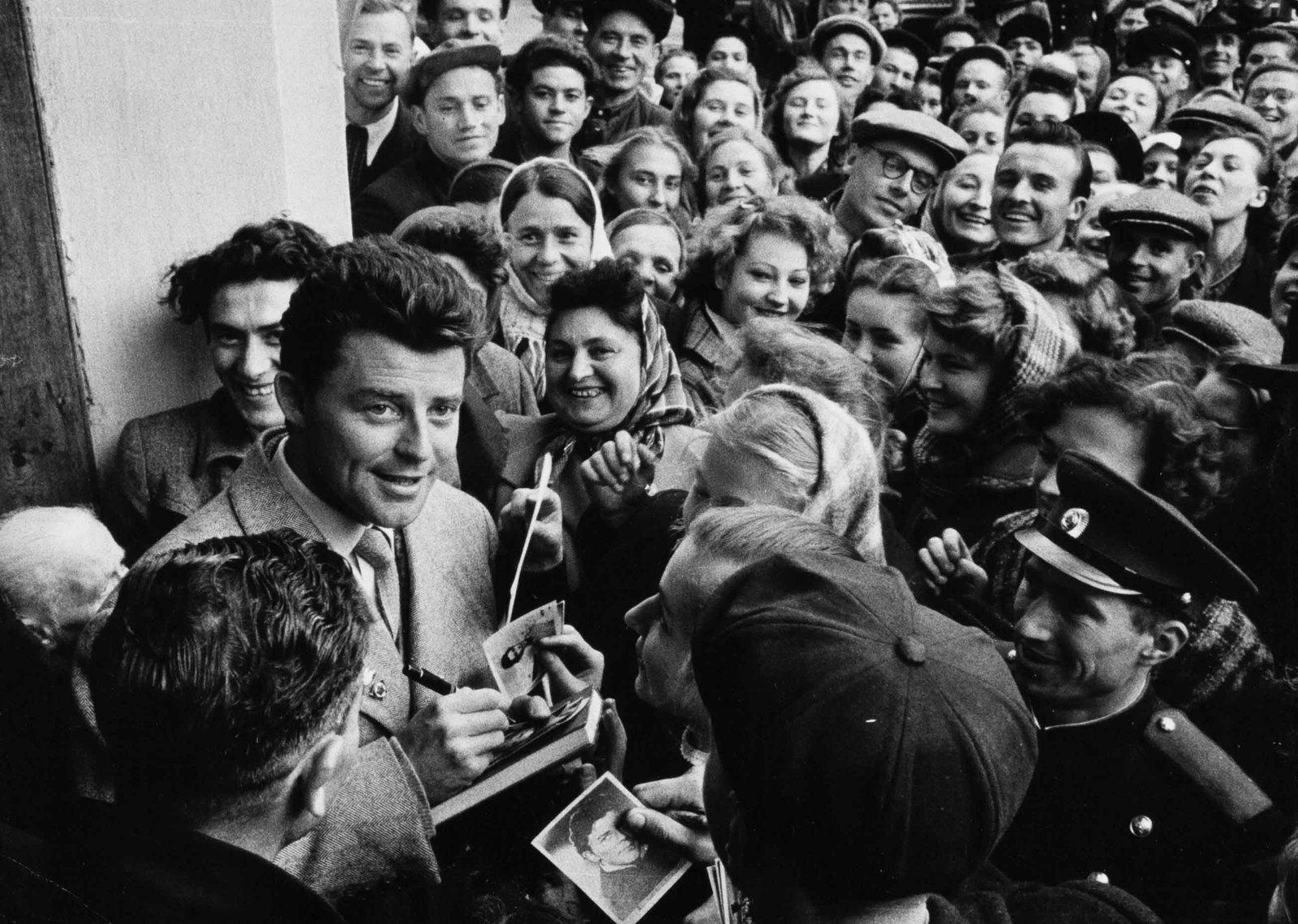 PRIVATE | "La Semaine du Cinéma Français" (The French Film Week), 1955: Vintage print, stamped, 13 x 18 cm This historic photo captures the famous French actor G?rard Philipe signing autographs for a passionate crowd of Soviet fans in Moscow in October 1955. He was visiti