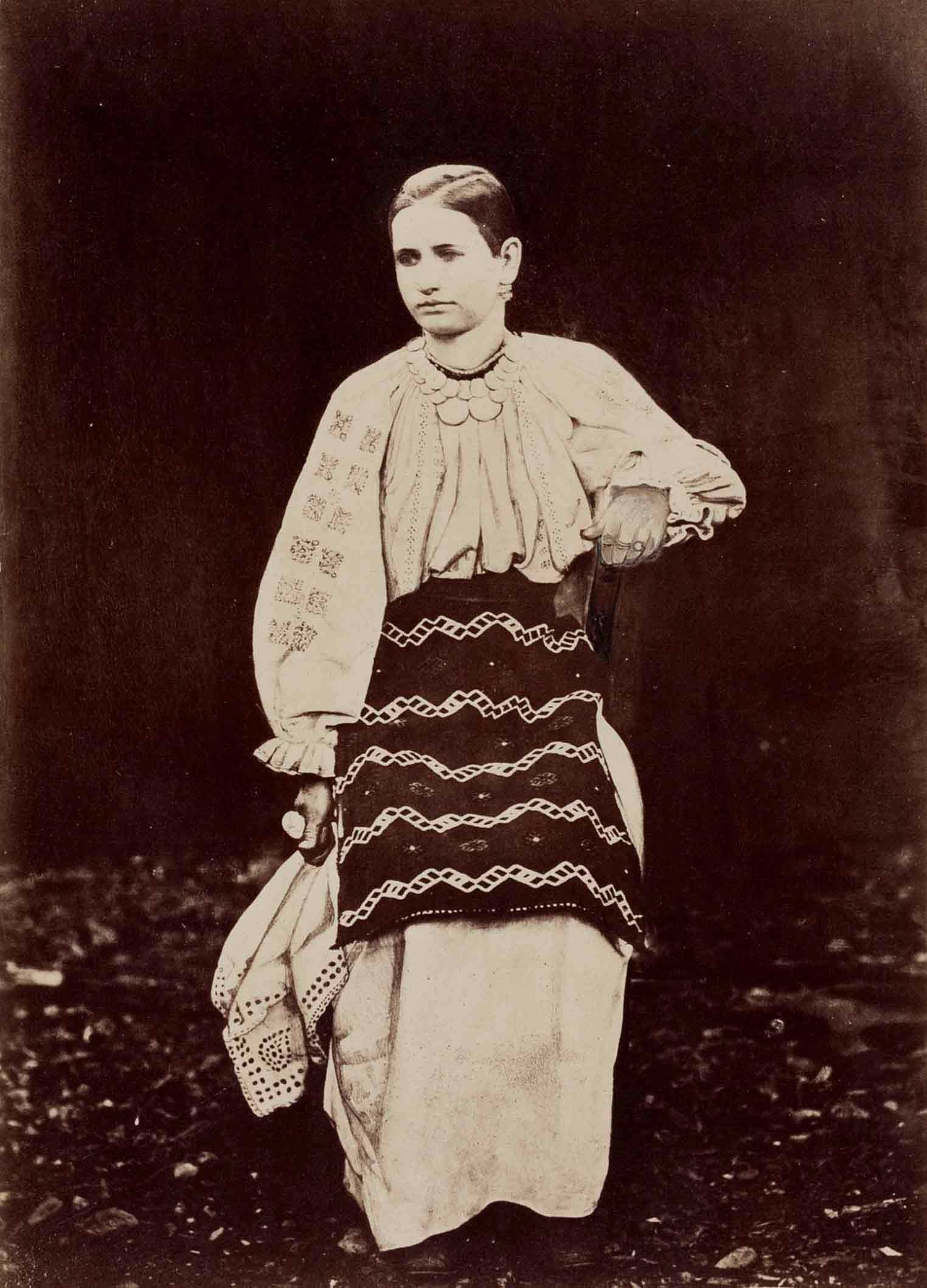 ANDREAS GROLL (1812–1872): ANDREAS GROLL (1812–1872) | Girl from Romanian-Bogsan, Banat 1860 Image Size: 27.1 x 19.5 cm English Albumen print, flush-mounted on the original board 50.3 x 39.4 cm, in very good condition,