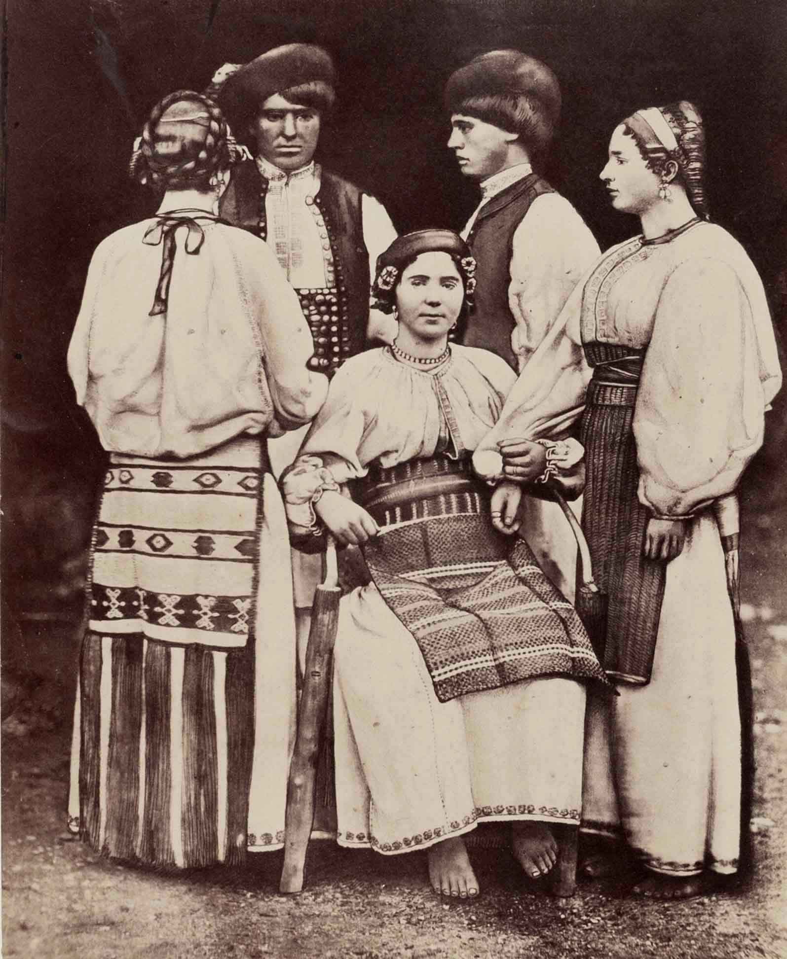 ANDREAS GROLL (1812–1872): ANDREAS GROLL (1812–1872) | Young people from Romanian-Szaszka, Banat 1860 Image Size: 25.5 x 20.5 cm English Albumen print, flush-mounted on the original board 50.1 x 39.5 cm, in very good