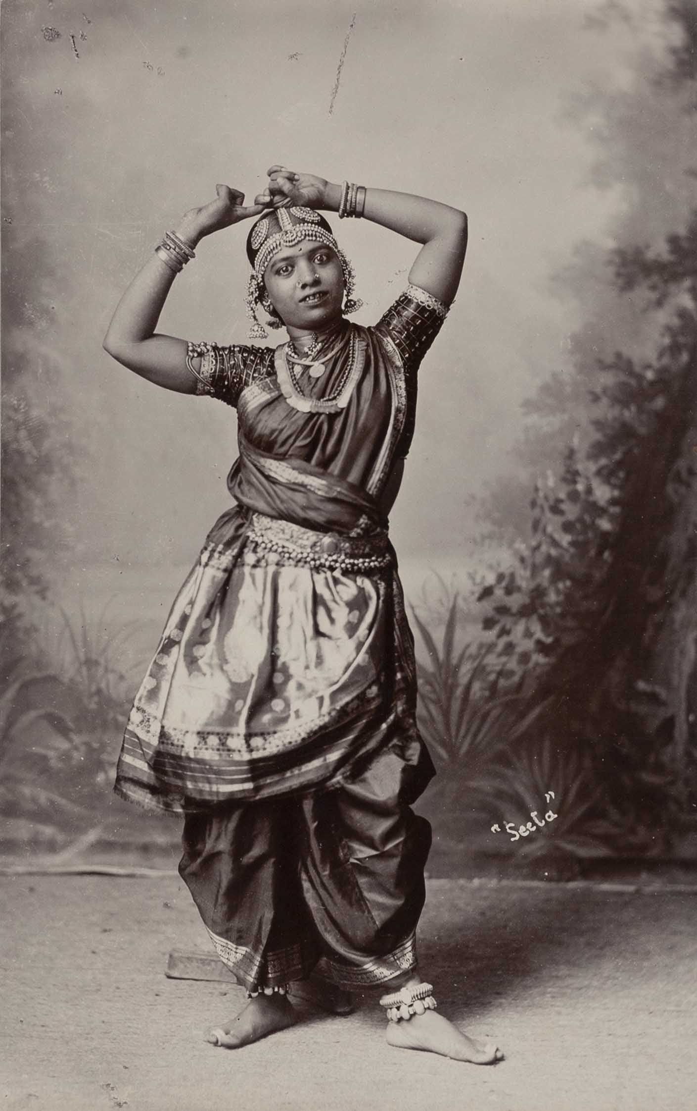 NICHOLAS & CO. MADRAS (1857–c. 1905): NICHOLAS & CO. MADRAS (1857–c. 1905) | 'Seela' – Dancing girl, Tamil, Chennai c. 1890 Image Size: 14.8 x 9.3 cm English Albumen print, flush-mounted on the original board 32.7 x 21.7 cm,
