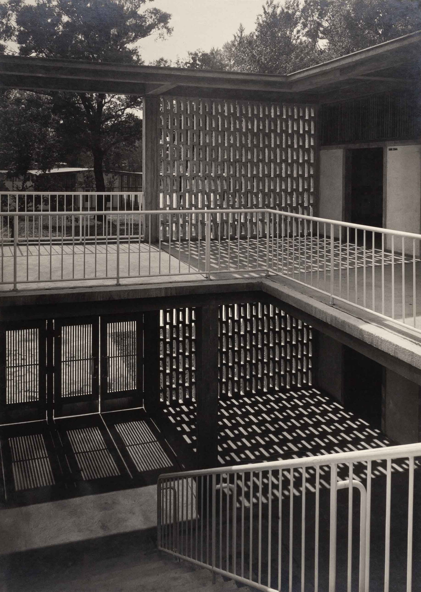 LUCCA CHMEL (1911–1999): LUCCA CHMEL (1911–1999) | Changing rooms at the 'Strandbad Gänsehäufel', Vienna 1950 Image Size: 38.3 x 27.6 cm English Vintage gelatin silver print, flush-mounted on the original boar