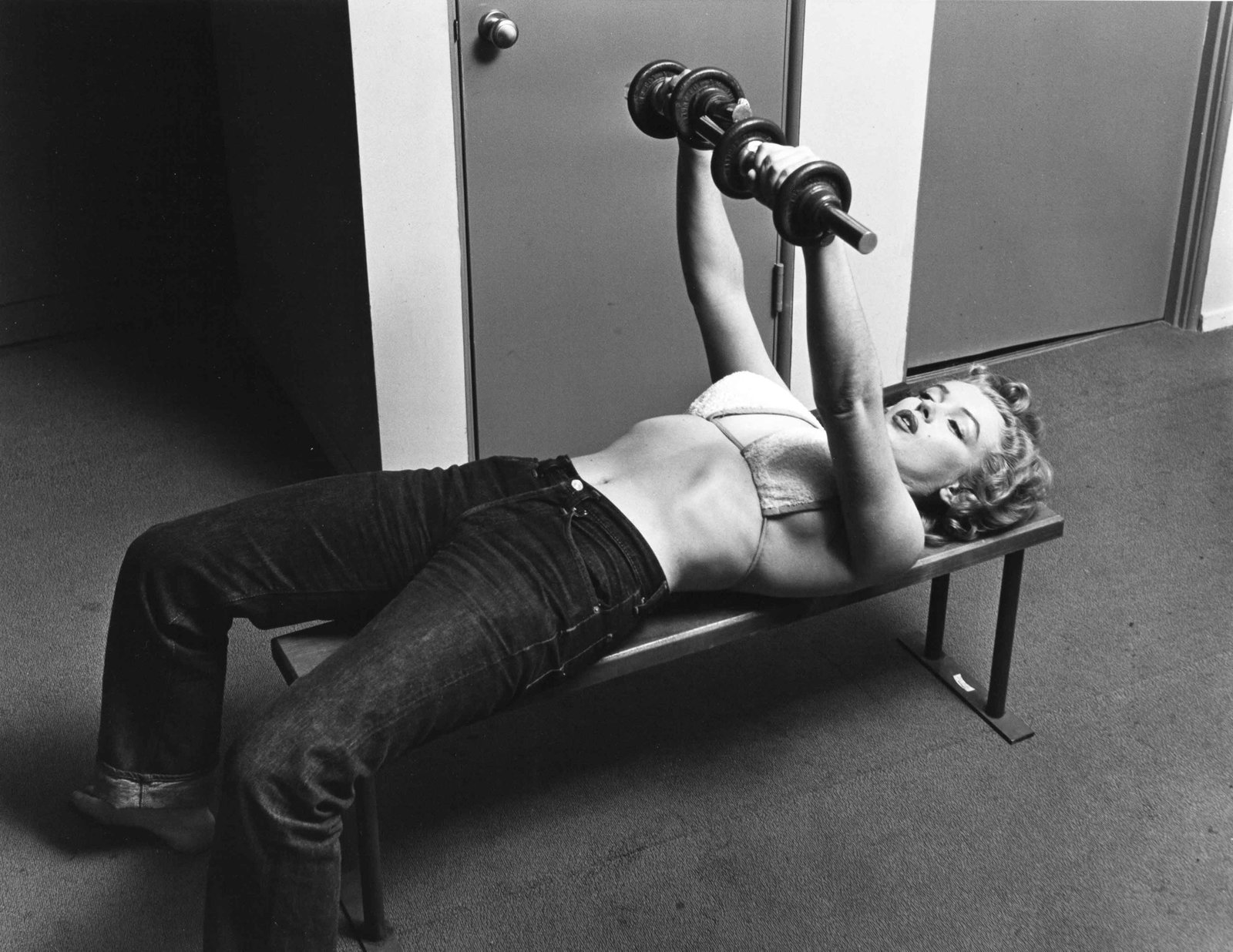PHILIPPE HALSMAN (1906–1979): PHILIPPE HALSMAN (1906–1979) | 'Marilyn weightlifting', Los Angeles 1952 Image Size: 25.3 x 32.9 cm English Gelatin silver print, printed in 1981 by Stephen Gersh, 27.8 x 35.3 cm, in very good c