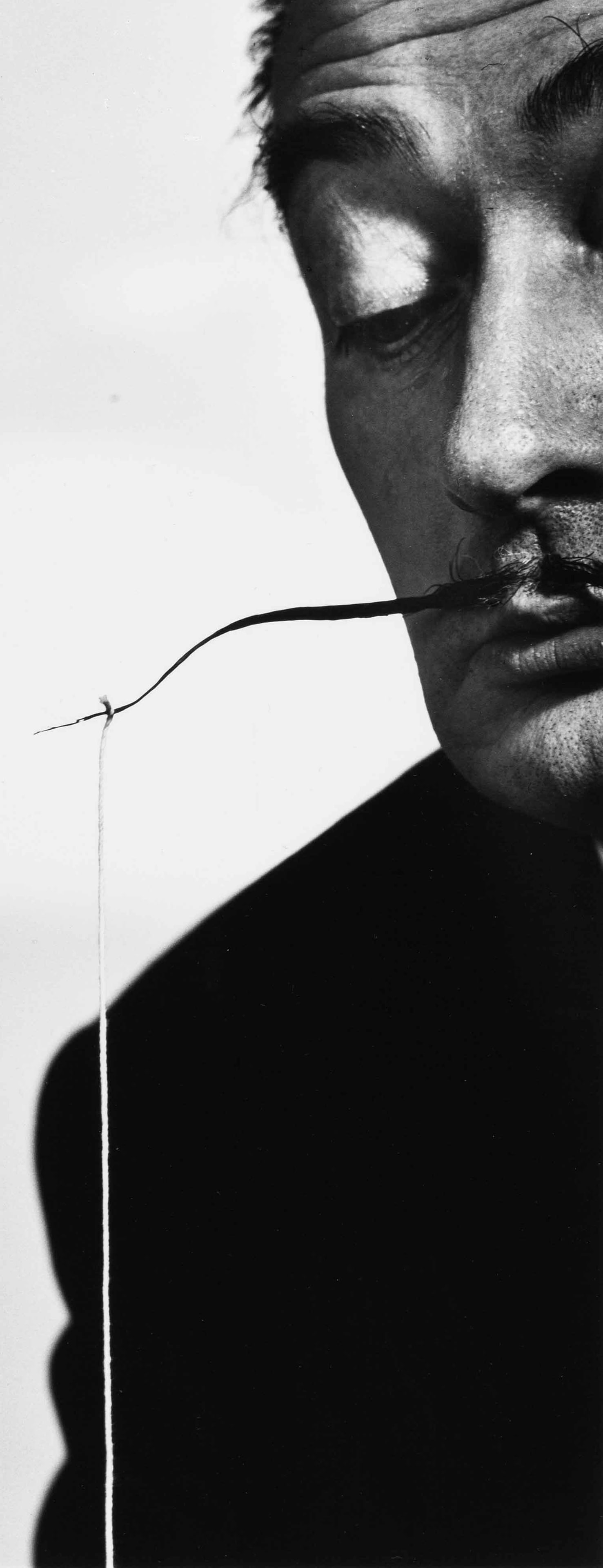 PHILIPPE HALSMAN (1906–1979): PHILIPPE HALSMAN (1906–1979) | 'Dalí fishing', 1953 Image Size: c. 33 x 13 cm English Gelatin silver print, printed in 1981, 35.3 x 28 cm, in very good condition. Photographer's stamp