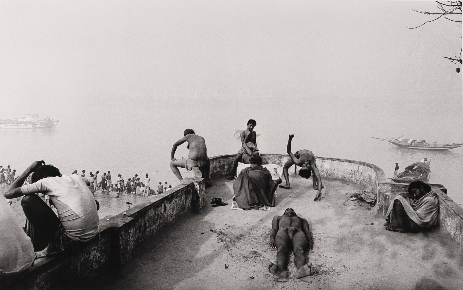 RAGHU RAI (1942–2026): RAGHU RAI (1942–2026) | Bodybuilders and Wrestlers on the Riverbank, Calcutta Image Size: 35.2 x 46.7 cm English Gelatin silver print, printed in 1989 on RC paper 60.5 x 50.7 cm, in good