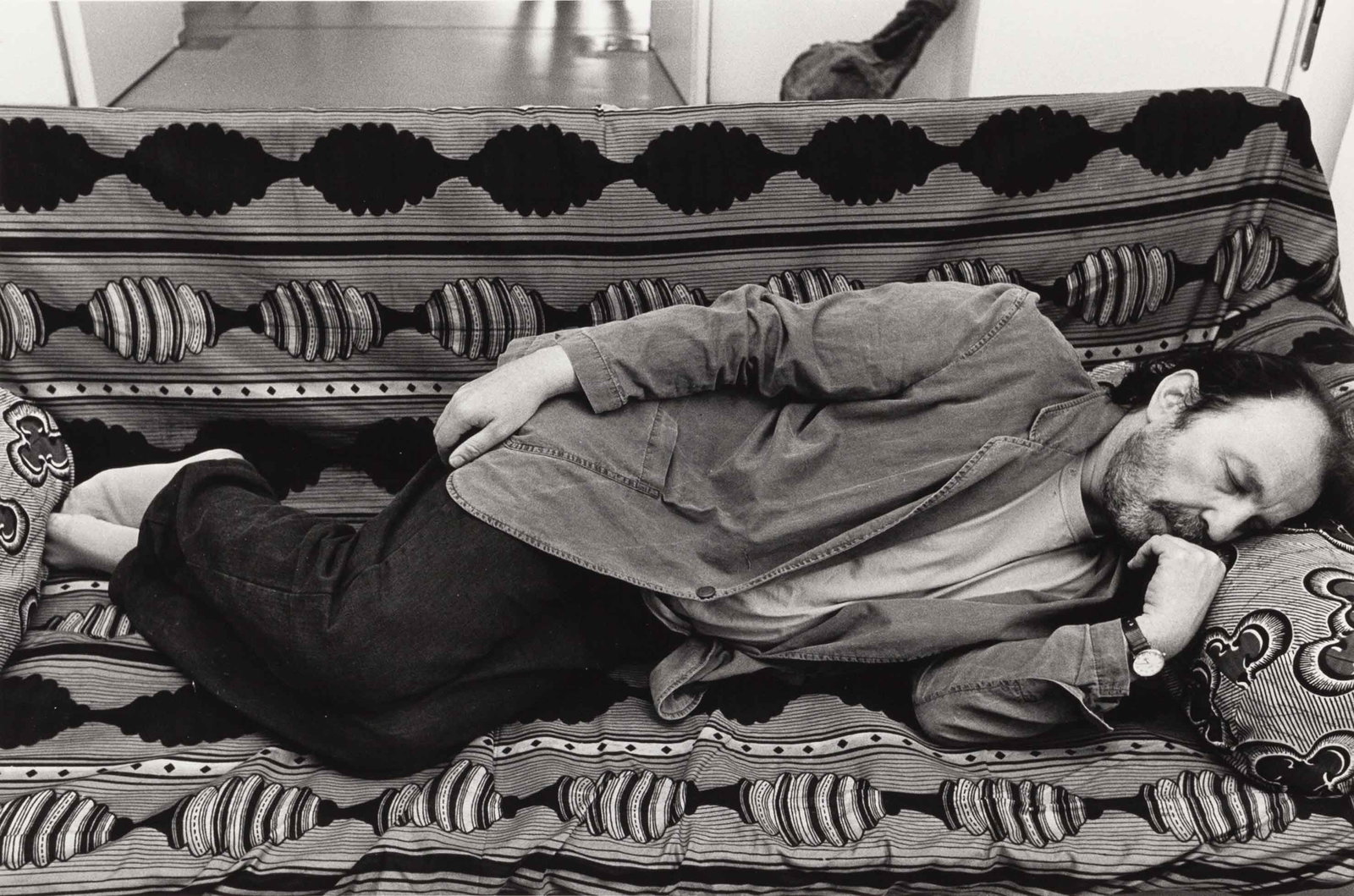 DIETER SCHWERDTLE (1952–2009): DIETER SCHWERDTLE (1952–2009) | Franz West sleeping on one of his sculptures, Kassel, Germany, 1988 Image Size: 17.9 x 26.9 cm English Gelatin silver print 20.5 x 30.5 cm, in excellent