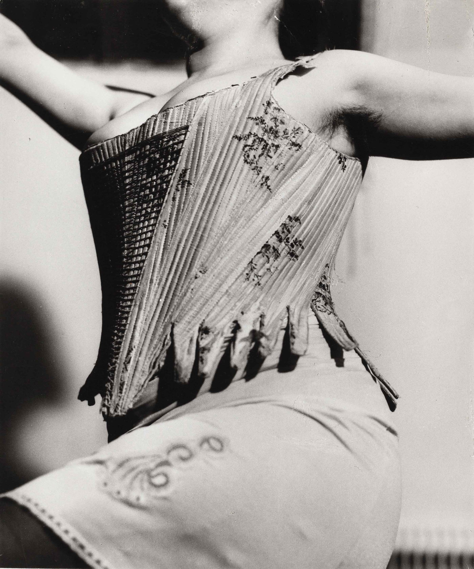CORA PONGRACZ (1943–2003): CORA PONGRACZ (1943–2003) | Erika Ringel's torso in corset, from the series 'Martha Jungwirth', Vienna c. 1971 Image Size: 21.9 x 18.2 cm English Vintage gelatin silver print on single-weight,