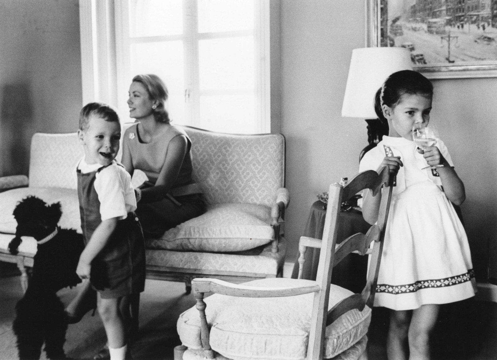 LUC FOURNOL (1931–2007): LUC FOURNOL (1931–2007) | Grace Kelly with her children Caroline and Albert, 1962 Image Size: 30 x 41.5 cm English Gelatin silver print, printed later, in excellent condition. Framed in black wo